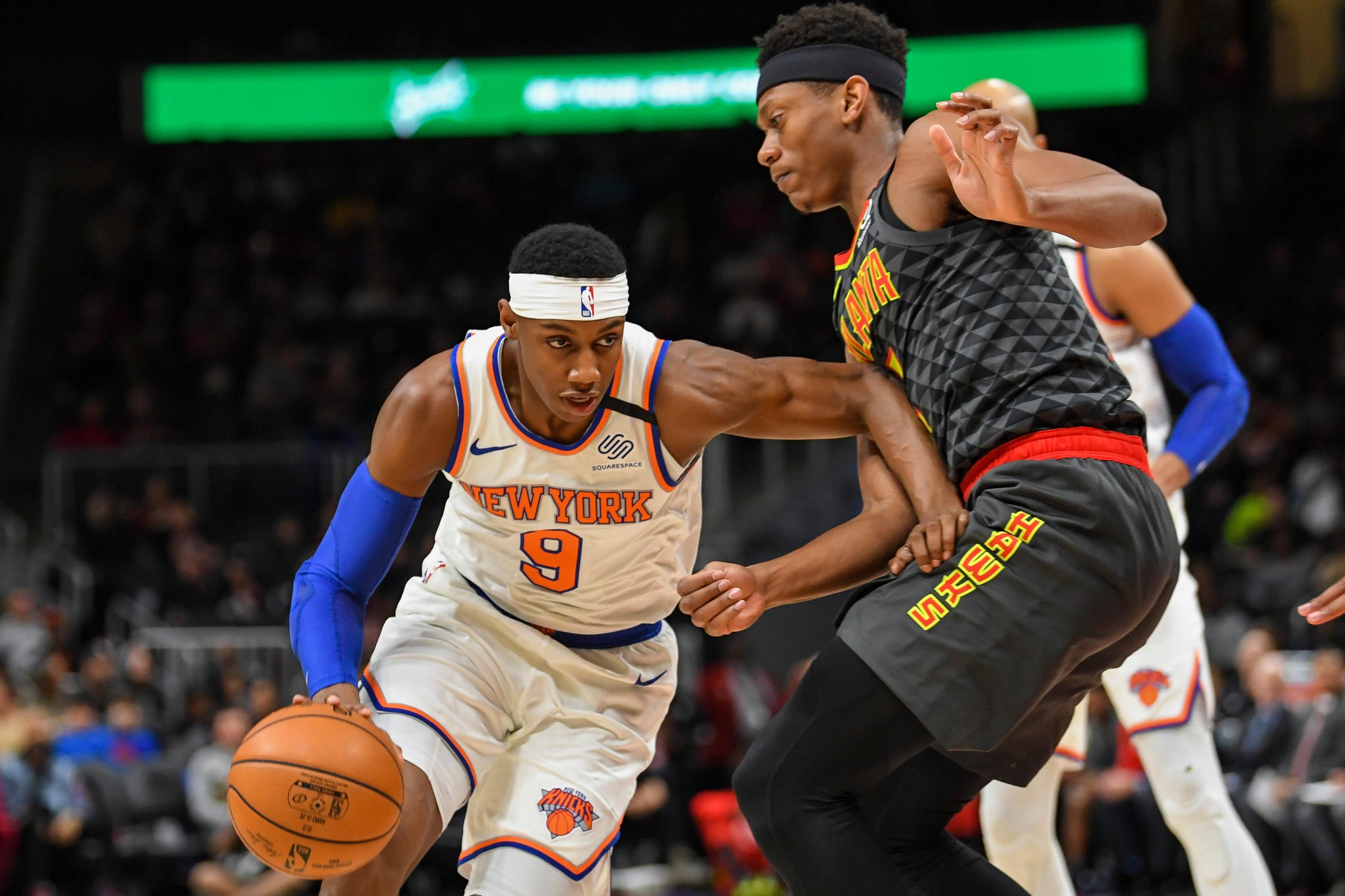 Feb 9, 2020; Atlanta, Georgia, USA; New York Knicks guard RJ Barrett (9) dribbles against Atlanta Hawks forward De'Andre Hunter (12) during the first quarter at State Farm Arena. Mandatory Credit: Dale Zanine-USA TODAY Sports / DALE ZANINE