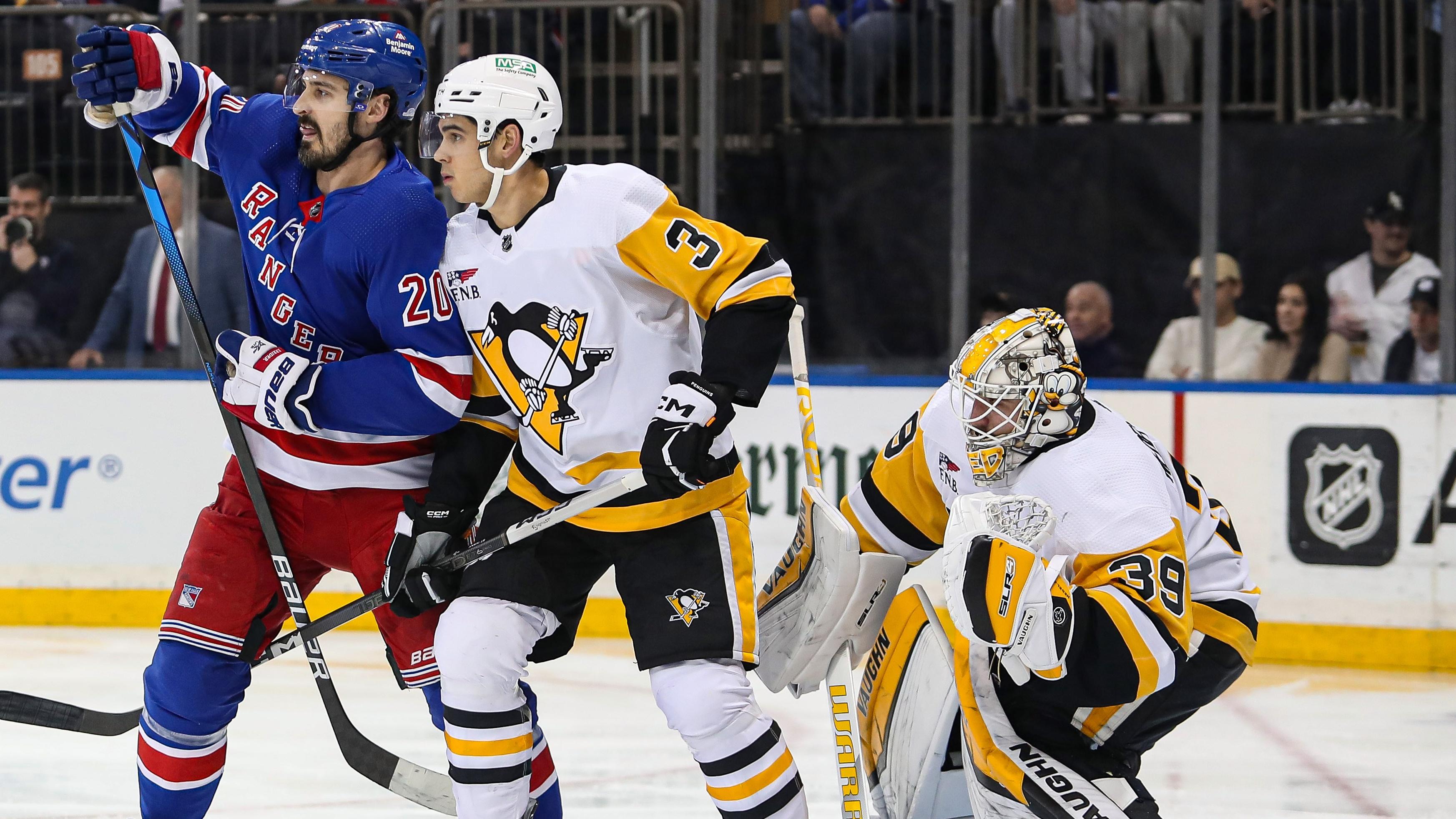 New York Rangers left wing Chris Kreider (20) and Pittsburgh Penguins defenseman Jack St. Ivany (3) battle for position in front of Pittsburgh Penguins goalie Alex Nedeljkovic (39) during the second period at Madison Square Garden / Danny Wild - USA TODAY Sports