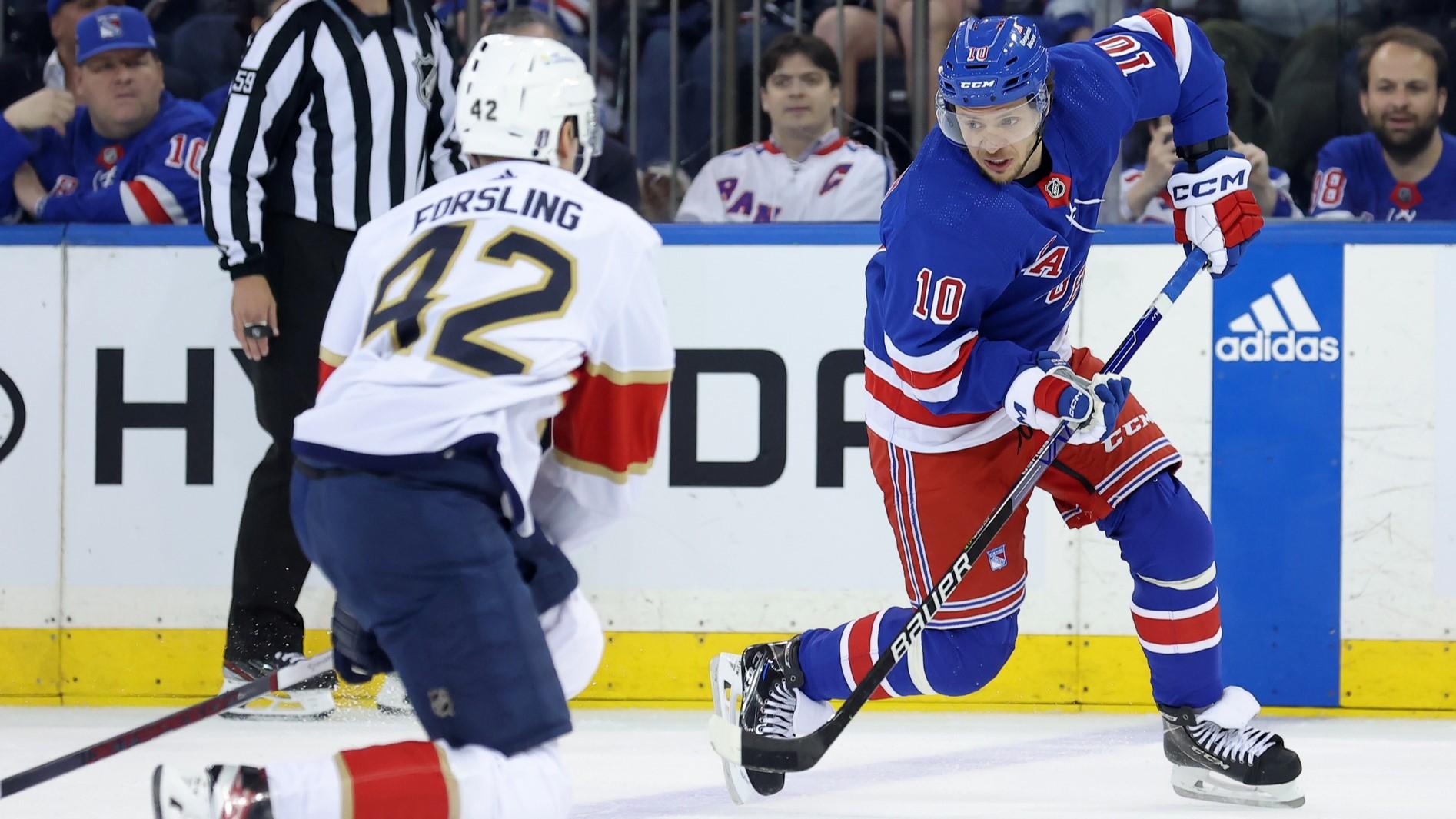 May 22, 2024; New York, New York, USA; New York Rangers left wing Artemi Panarin (10) plays the puck against Florida Panthers defenseman Gustav Forsling (42) during the first period of game one of the Eastern Conference Final of the 2024 Stanley Cup Playoffs at Madison Square Garden. / Brad Penner-USA TODAY Sports