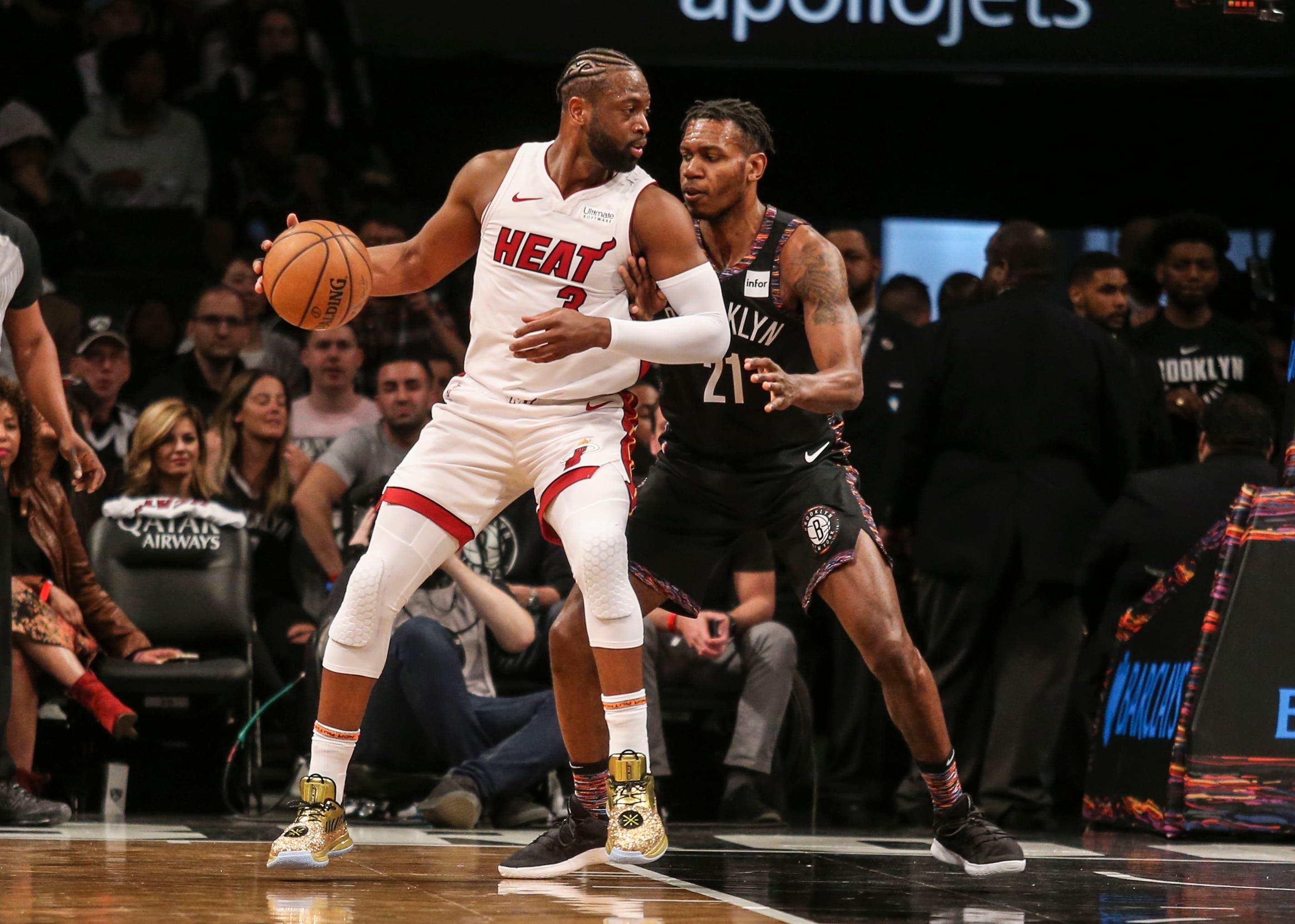 Apr 10, 2019; Brooklyn, NY, USA; Miami Heat guard Dwayne Wade (3) posts up against Brooklyn Nets guard Treveon Graham (21) in the first quarter at Barclays Center. Mandatory Credit: Wendell Cruz-USA TODAY Sports / Wendell Cruz