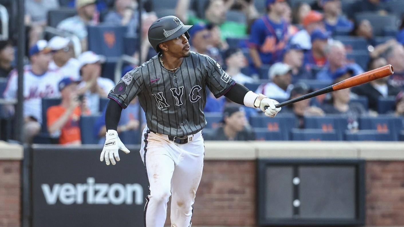 New York Mets shortstop Francisco Lindor (12) hits a three run home run in the eighth inning against the Colorado Rockies at Citi Field.