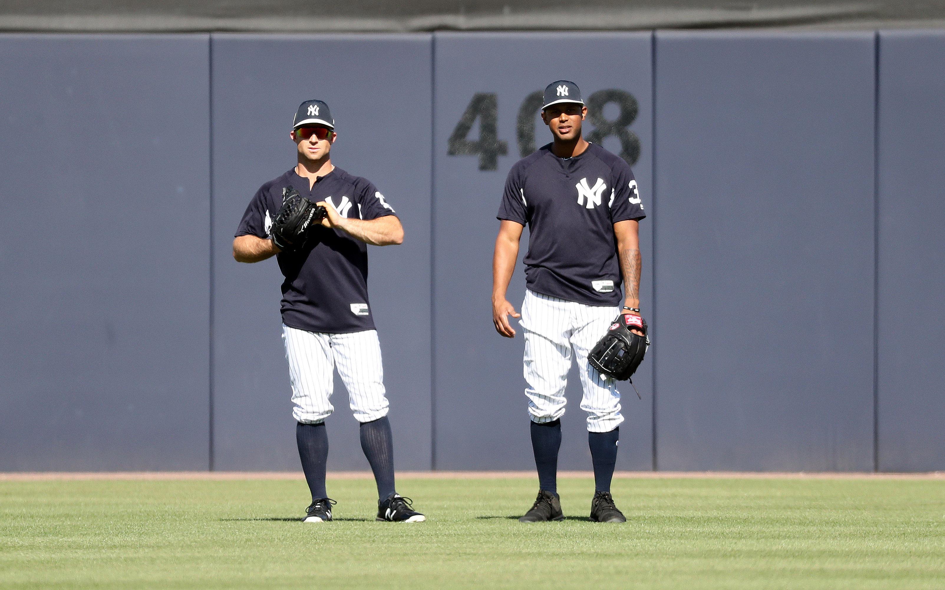 Mar 12, 2018; Tampa, FL, USA; New York Yankees center fielder Brett Gardner (11) and center fielder Aaron Hicks (31) look on prior to the game against the Minnesota Twins at George M. Steinbrenner Field. Mandatory Credit: Kim Klement-USA TODAY Sports