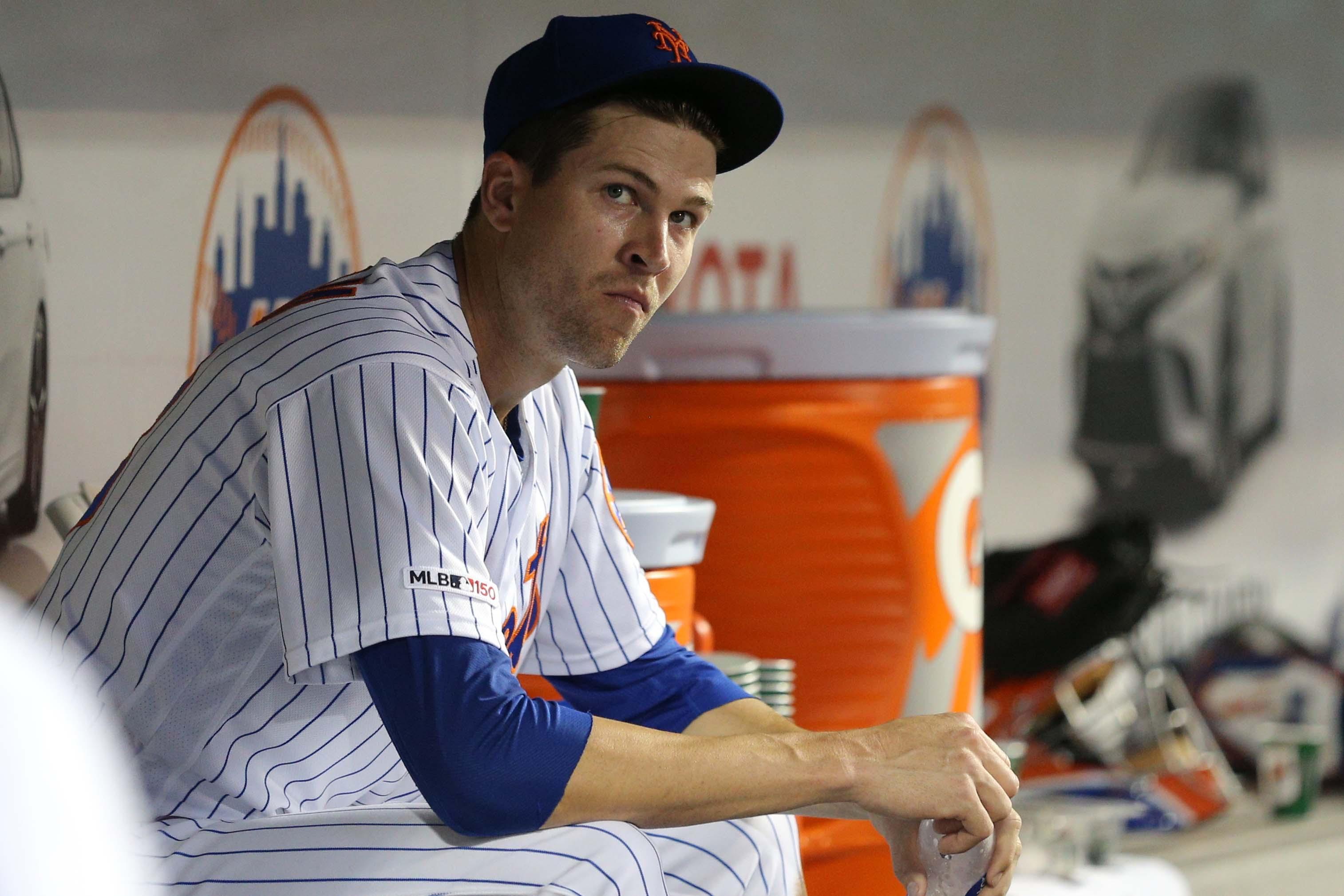 Jun 7, 2019; New York City, NY, USA; New York Mets starting pitcher Jacob DeGrom (48) reacts in the dugout during the fourth inning against the Colorado Rockies at Citi Field. Mandatory Credit: Brad Penner-USA TODAY Sports / Brad Penner