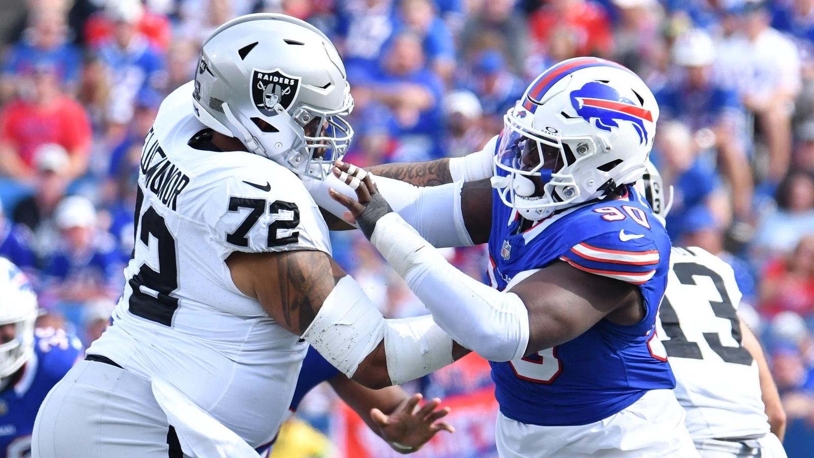 Buffalo Bills defensive end Shaq Lawson (90) pass rushes against Las Vegas Raiders guard Jermaine Eluemunor (72) in the fourth quarter at Highmark Stadium.