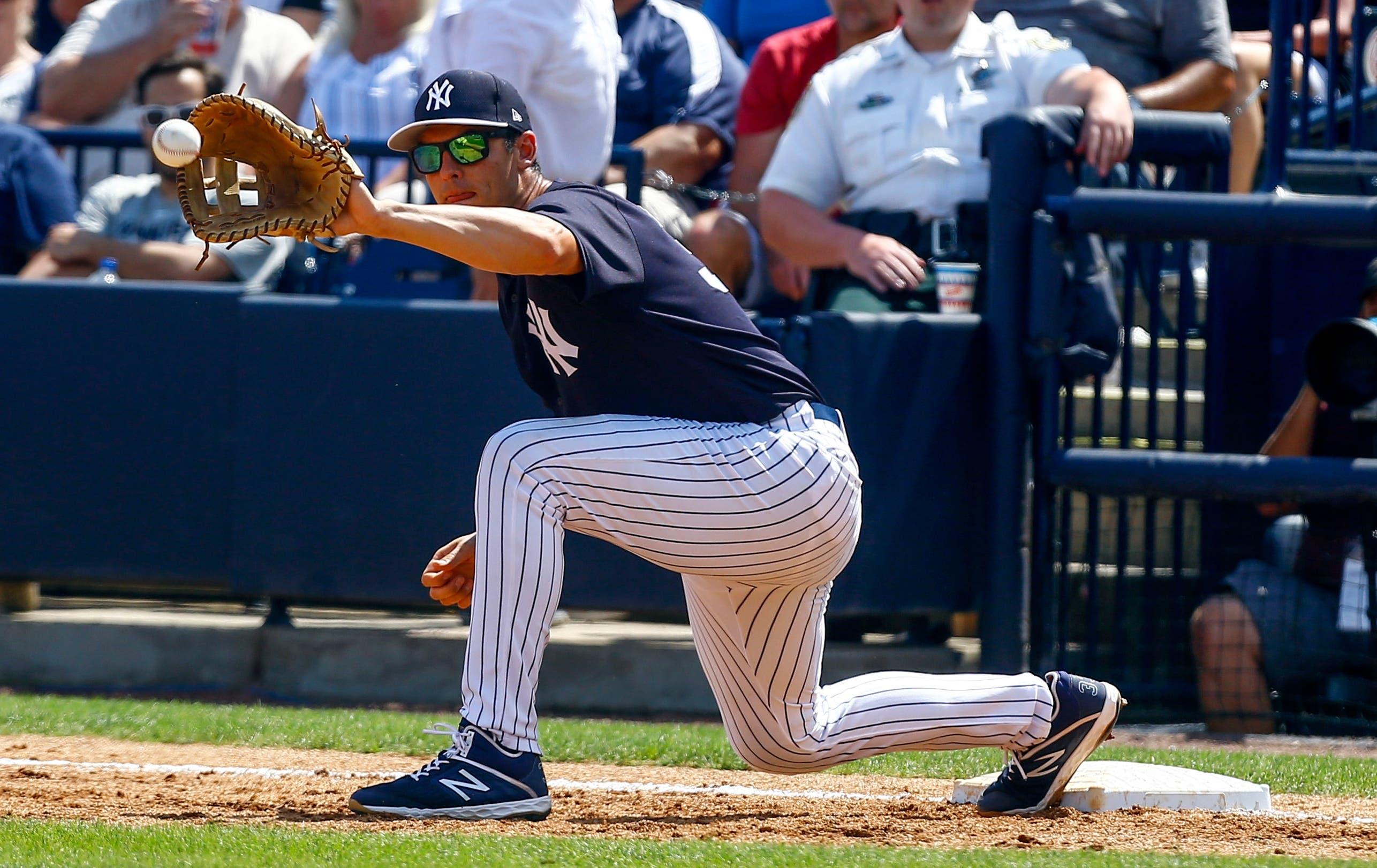 Mar 10, 2019; Tampa, FL, USA; New York Yankees first baseman Greg Bird (33) catches a throw to retire Pittsburgh Pirates outfielder Melky Cabrera (not pictured) during the third inning at George M. Steinbrenner Field. Mandatory Credit: Butch Dill-USA TODAY Sports / Butch Dill