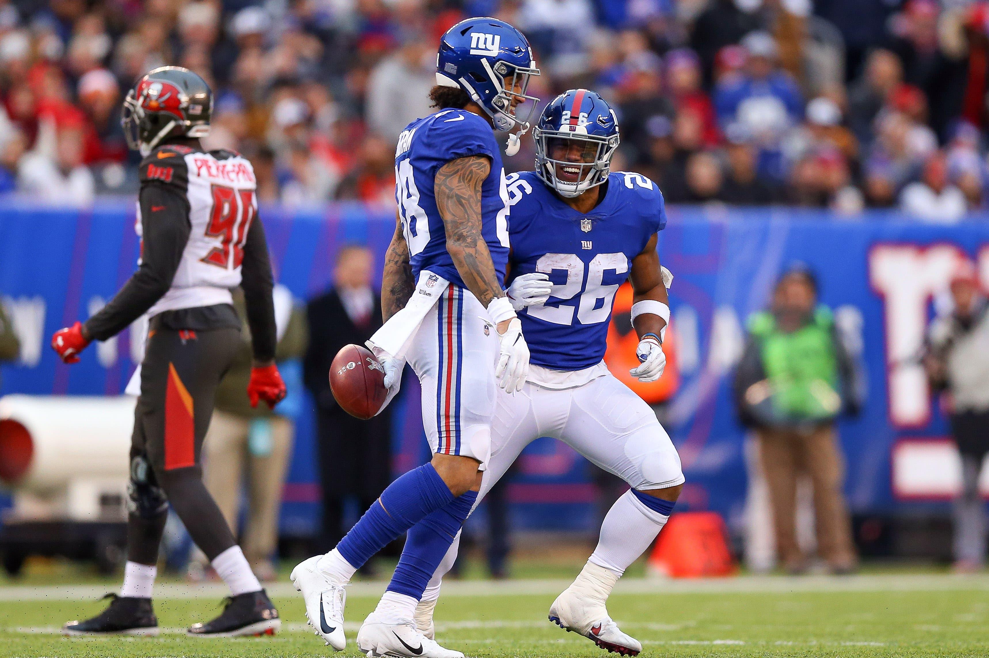 Nov 18, 2018; East Rutherford, NJ, USA; New York Giants running back Saquon Barkley (26) celebrates with New York Giants tight end Evan Engram (88) after his reception during the second half against the Tampa Bay Buccaneers at MetLife Stadium. Mandatory Credit: Vincent Carchietta-USA TODAY Sports / Vincent Carchietta