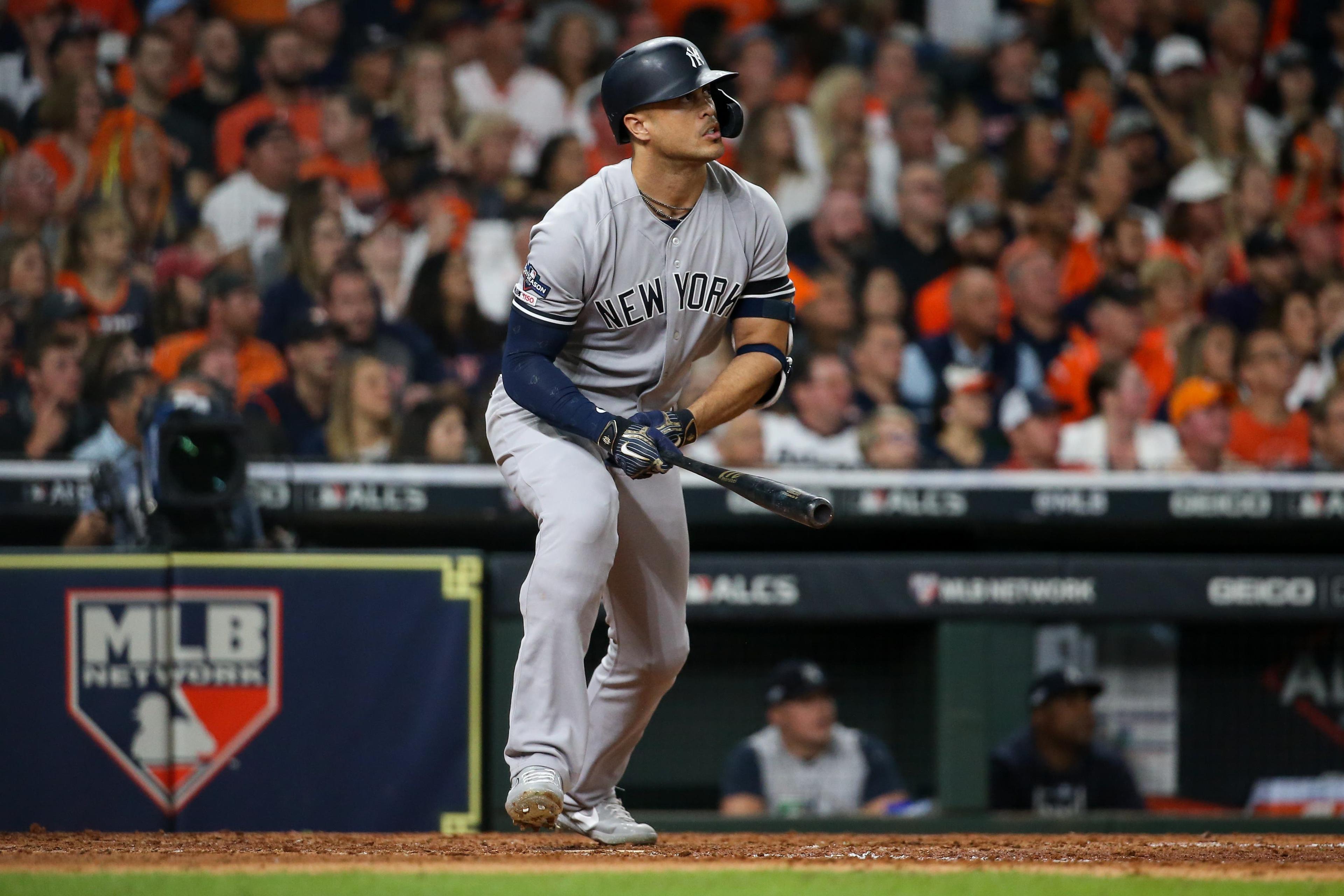 Oct 12, 2019; Houston, TX, USA; New York Yankees left fielder Giancarlo Stanton (27) hits a solo home run against the Houston Astros in the sixth inning in game one of the 2019 ALCS playoff baseball series at Minute Maid Park. Mandatory Credit: Troy Taormina-USA TODAY Sports / Troy Taormina