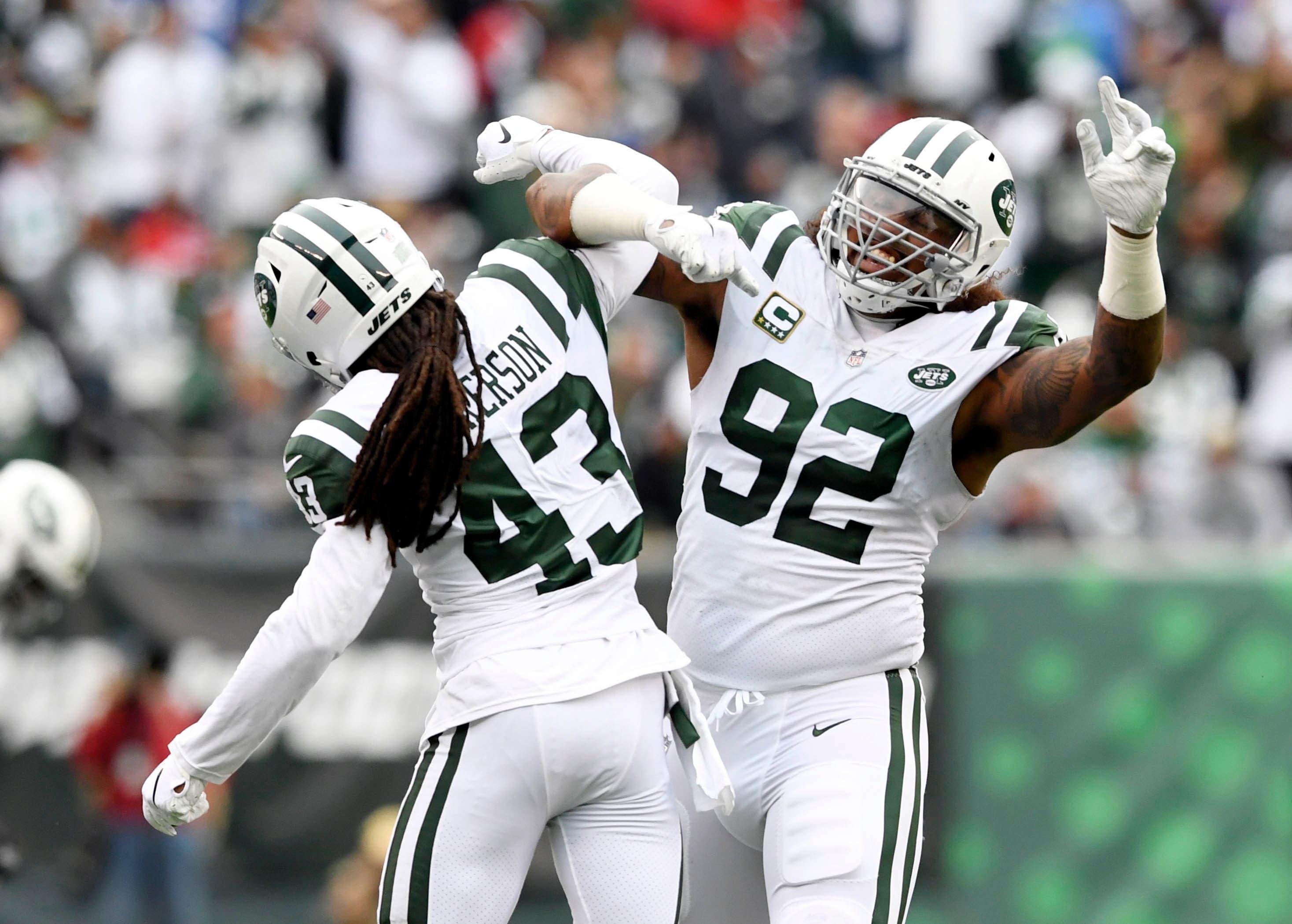 Oct 14, 2018; East Rutherford, NJ, USA; New York Jets cornerback Parry Nickerson (43) and defensive end Leonard Williams (92) celebrate a fumble by the Indianapolis Colts during a NFL game at MetLife Stadium. Mandatory Credit: Danielle Parhizkaran/NorthJersey.com via USA TODAY NETWORK / Danielle Parhizkaran