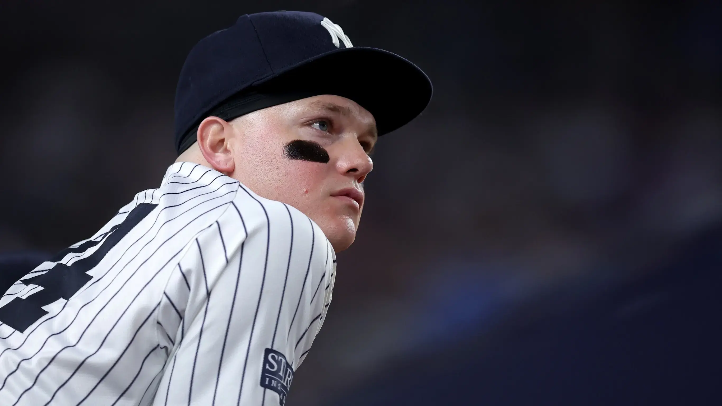 Jul 24, 2024; Bronx, New York, USA; New York Yankees left fielder Alex Verdugo (24) watches from the dugout during the seventh inning against the New York Mets at Yankee Stadium.