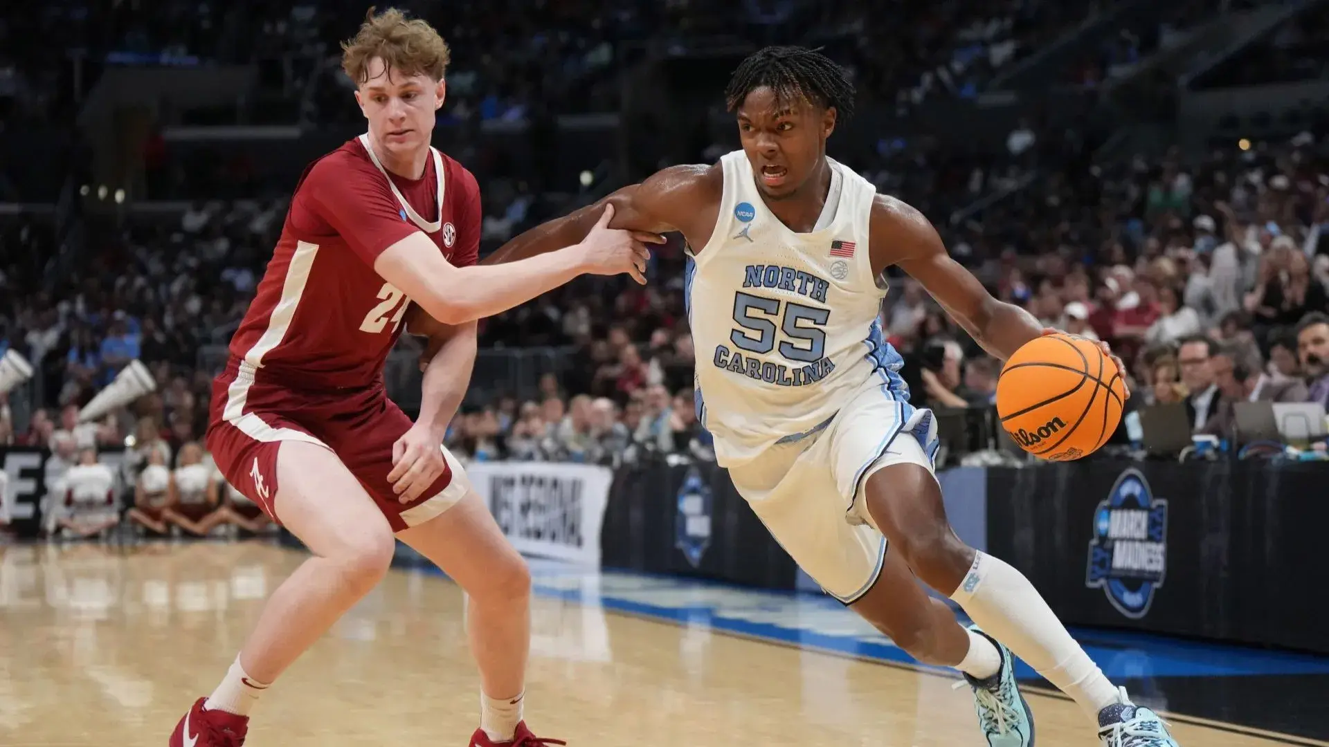 Mar 28, 2024; Los Angeles, CA, USA; North Carolina Tar Heels forward Harrison Ingram (55) controls the ball against Alabama Crimson Tide forward Sam Walters (24) in the second half in the semifinals of the West Regional of the 2024 NCAA Tournament at Crypto.com Arena. / Kirby Lee-USA TODAY Sports
