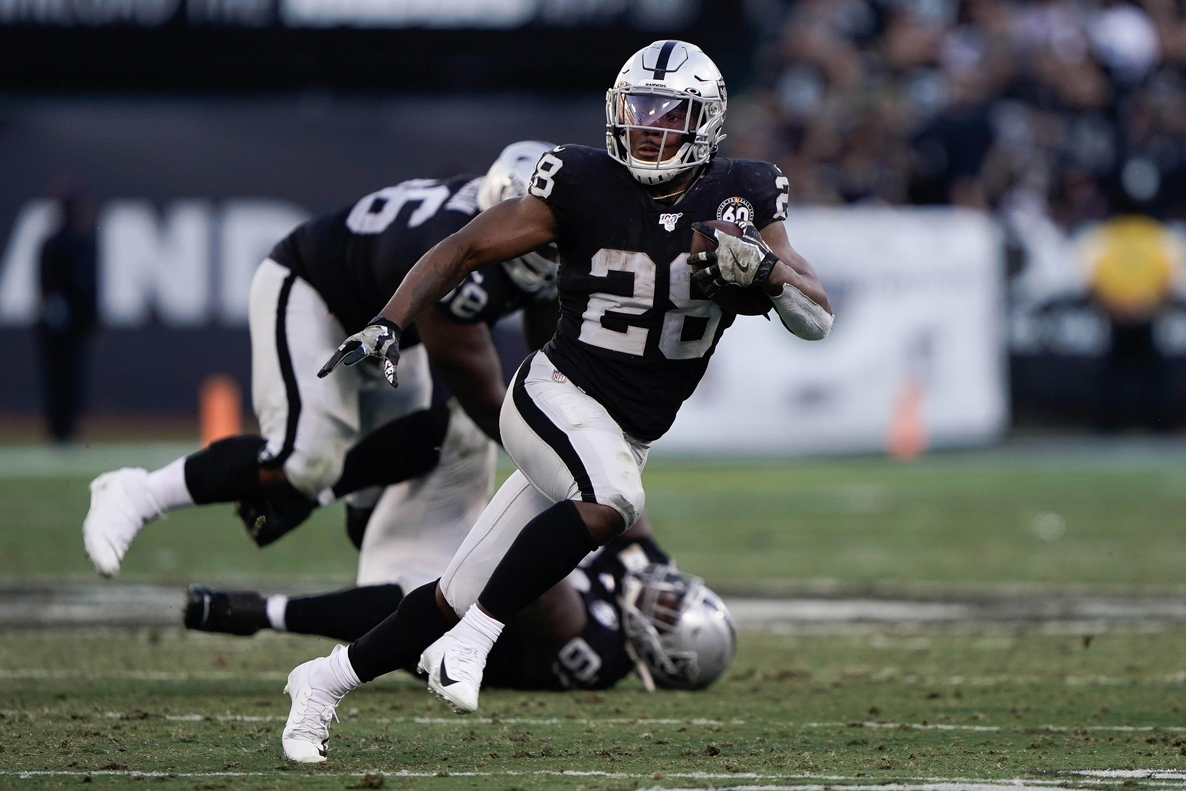 Nov 17, 2019; Oakland, CA, USA; Oakland Raiders running back Josh Jacobs (28) runs with the football in the game against the Cincinnati Bengals during the fourth quarter at the Oakland Coliseum. Mandatory Credit: Stan Szeto-USA TODAY Sports