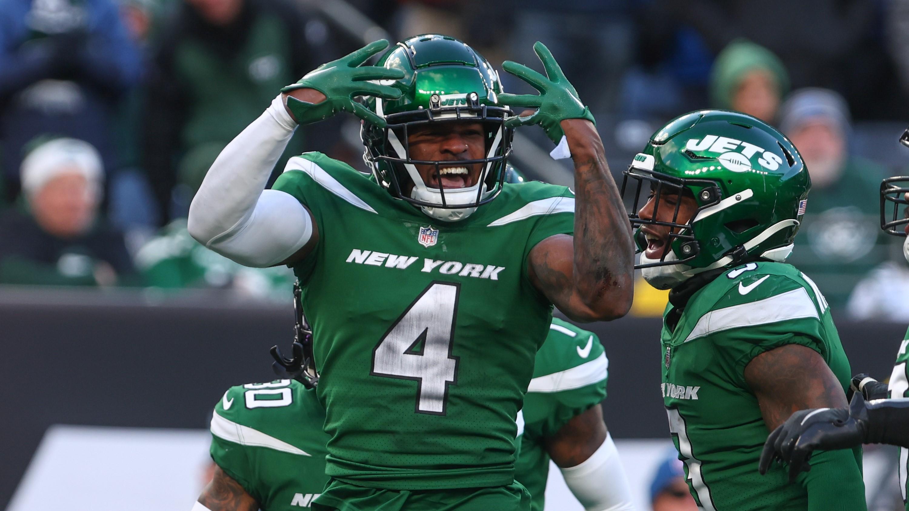 Dec 18, 2022; East Rutherford, New Jersey, USA; New York Jets cornerback D.J. Reed (4) celebrates a defensive stop against the Detroit Lions during the second half at MetLife Stadium. Mandatory Credit: Ed Mulholland-USA TODAY Sports