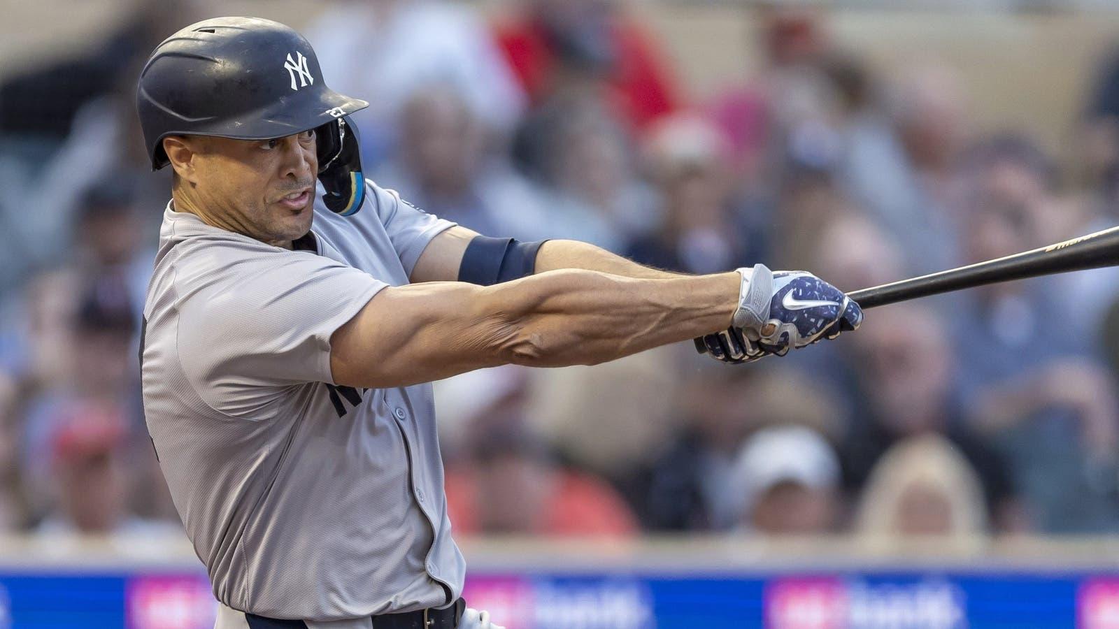 New York Yankees designated hitter Giancarlo Stanton (27) hits a single against the Minnesota Twins in the fourth inning at Target Field. / Jesse Johnson-USA TODAY Sports