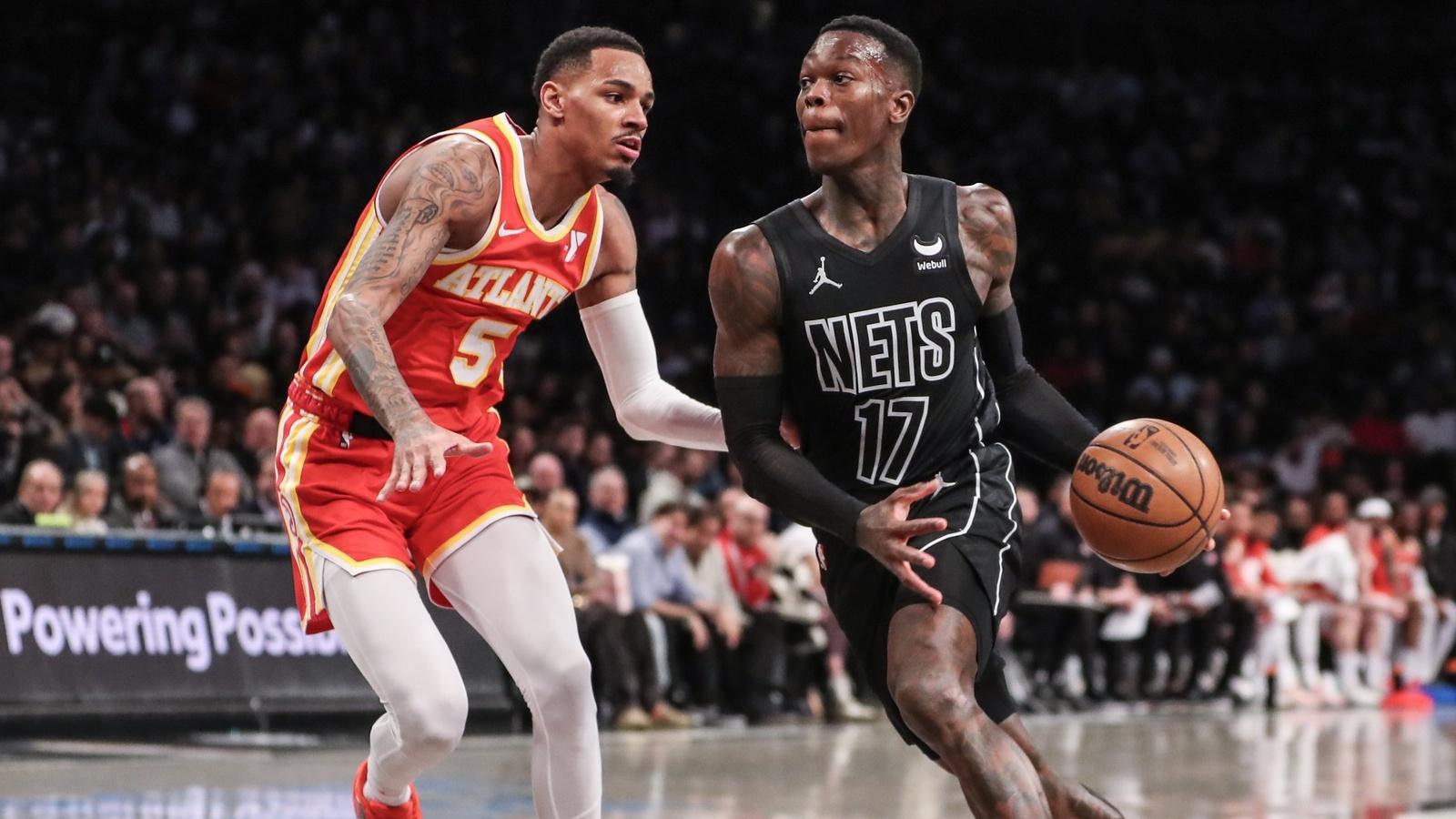 Brooklyn Nets guard Dennis Schroder (17) looks to drive past Atlanta Hawks guard Dejounte Murray (5) in the second quarter at Barclays Center. / Wendell Cruz-USA TODAY Sports