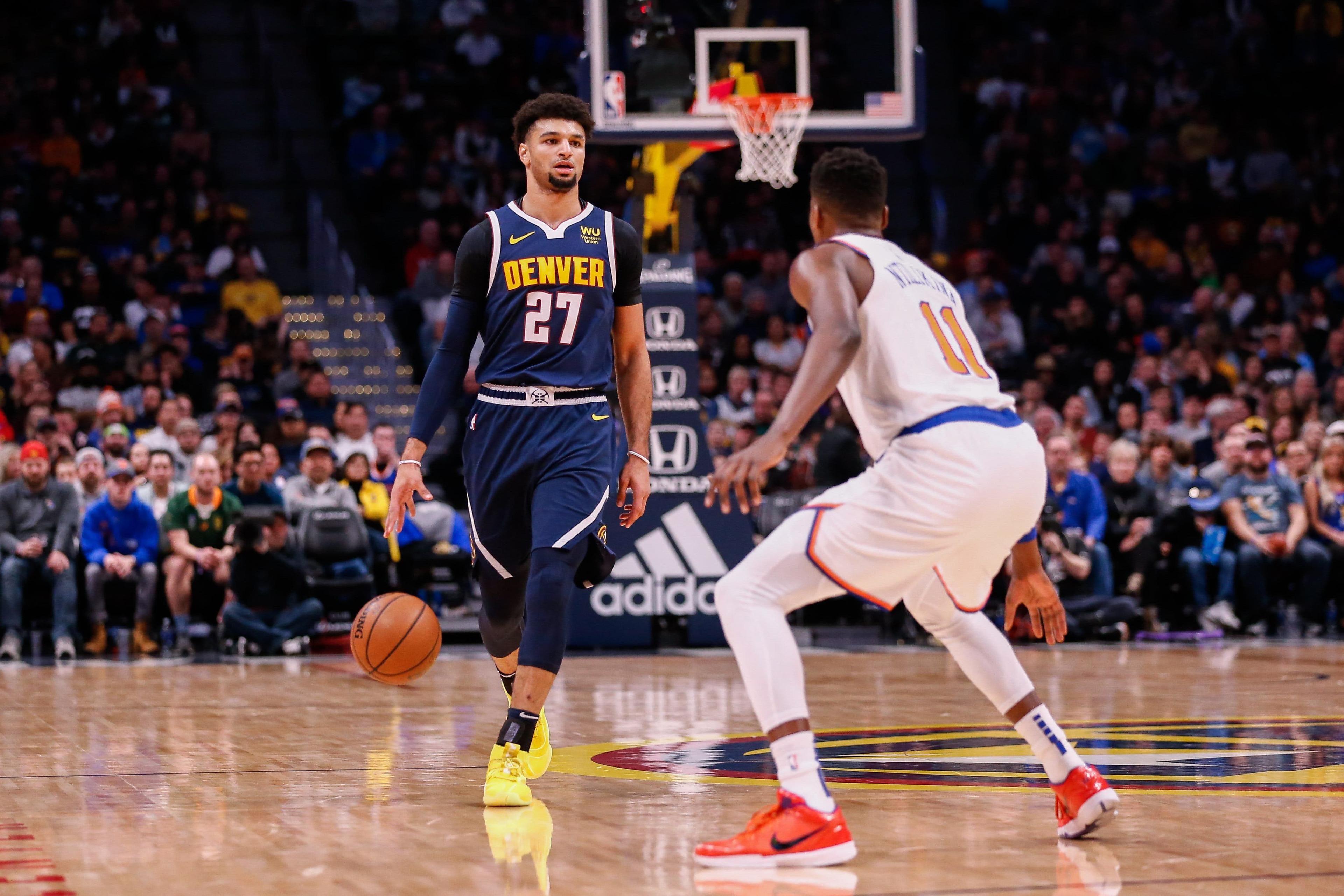 Dec 15, 2019; Denver, CO, USA; Denver Nuggets guard Jamal Murray (27) dribbles the ball up court as New York Knicks guard Frank Ntilikina (11) guards in the first quarter at the Pepsi Center. Mandatory Credit: Isaiah J. Downing-USA TODAY Sportss / Isaiah J. Downing