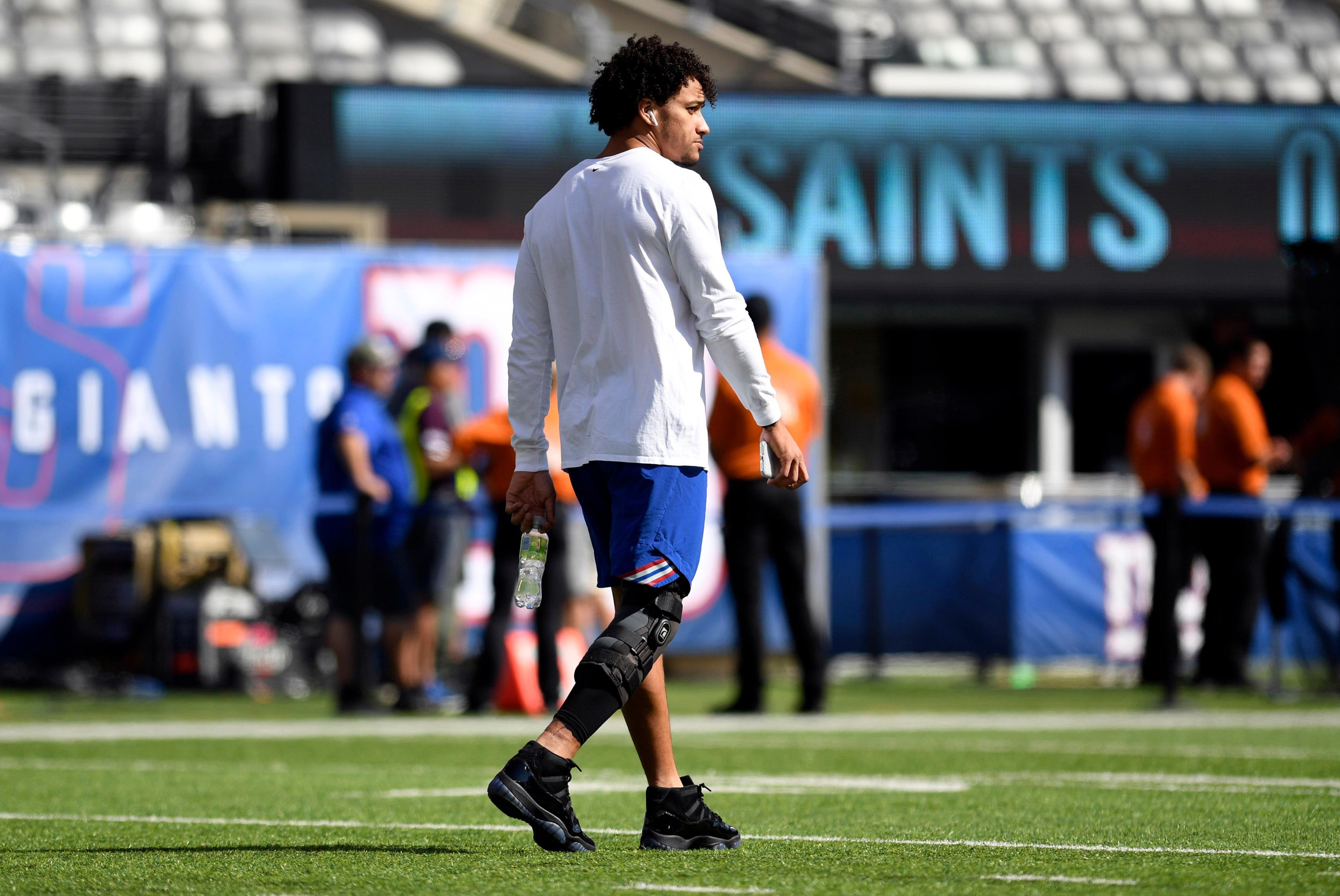 Sep 30, 2018; East Rutherford, NJ, USA; New York Giants tight end Evan Engram walks with a brace on his right knee after spraining his MCL in Houston. Engram will not play against the New Orleans Saints in Week 4. Mandatory Credit: Danielle Parhizkaran/NorthJersey.com via USA TODAY NETWORK / Danielle Parhizkaran