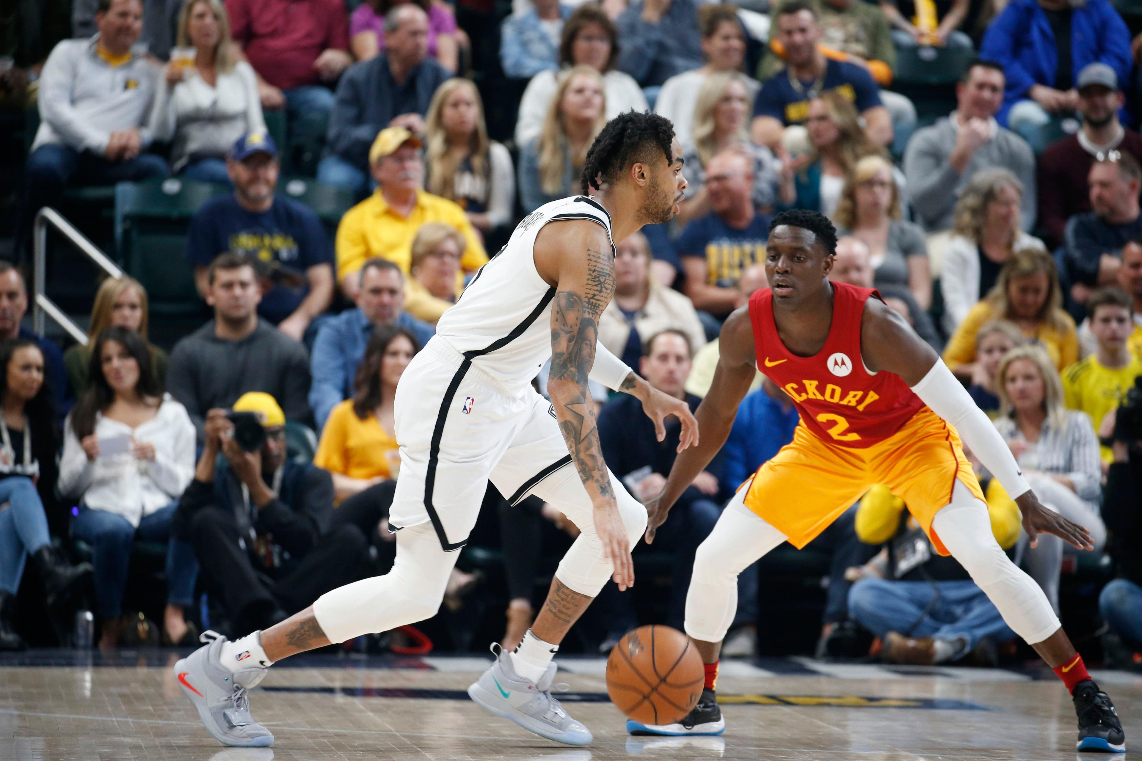 Apr 7, 2019; Indianapolis, IN, USA; Brooklyn Nets guard D'Angelo Russell (1) dribbles the ball against Indiana Pacers guard Darren Collison (2) during the first quarter at Bankers Life Fieldhouse. Mandatory Credit: Brian Spurlock-USA TODAY Sports / Brian Spurlock