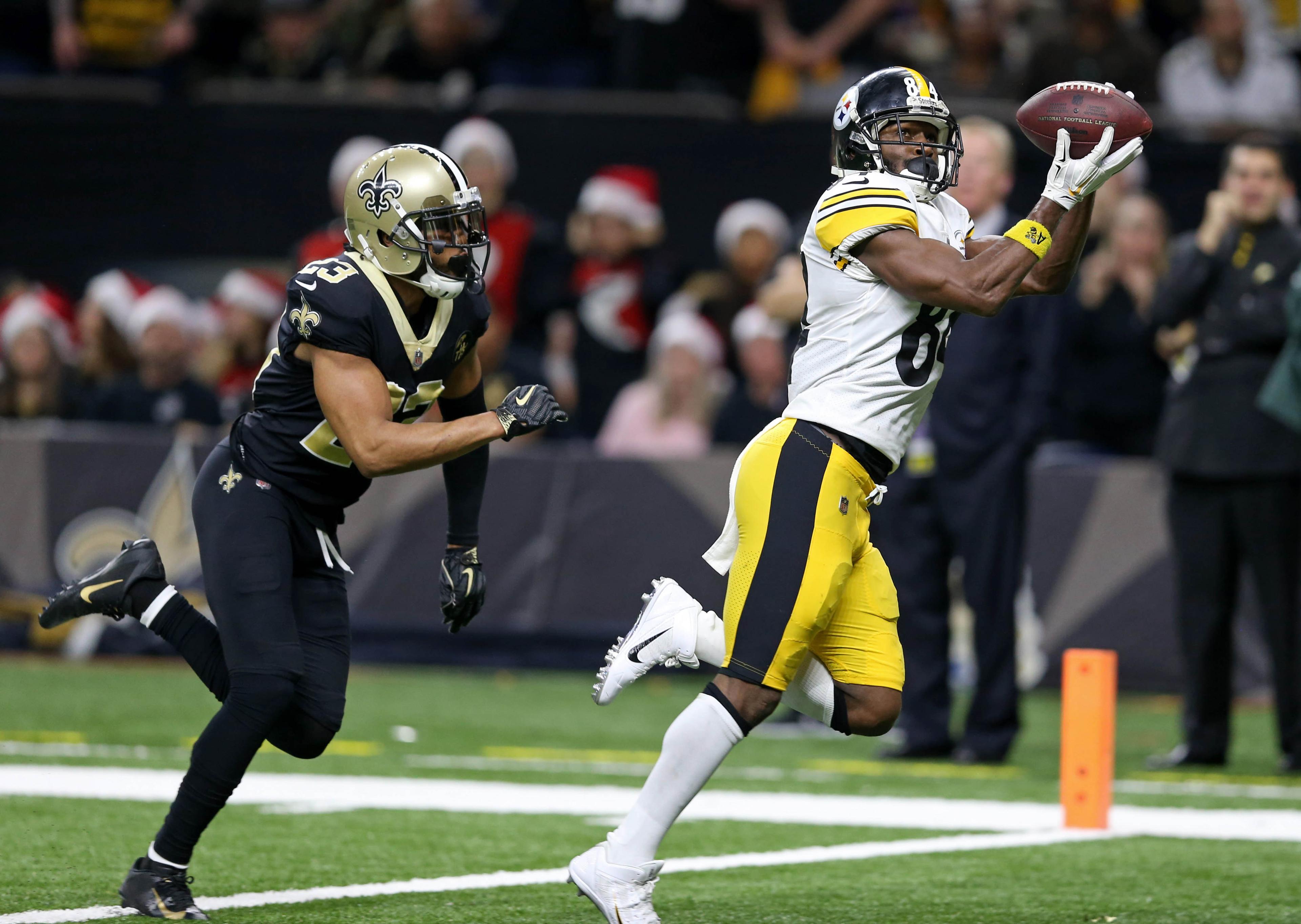 Dec 23, 2018; New Orleans, LA, USA; Pittsburgh Steelers wide receiver Antonio Brown (84) catches a touchdown while defended by New Orleans Saints cornerback Marshon Lattimore (23) in the second half at the Mercedes-Benz Superdome. The Saints won, 31-28. Mandatory Credit: Chuck Cook-USA TODAY Sports