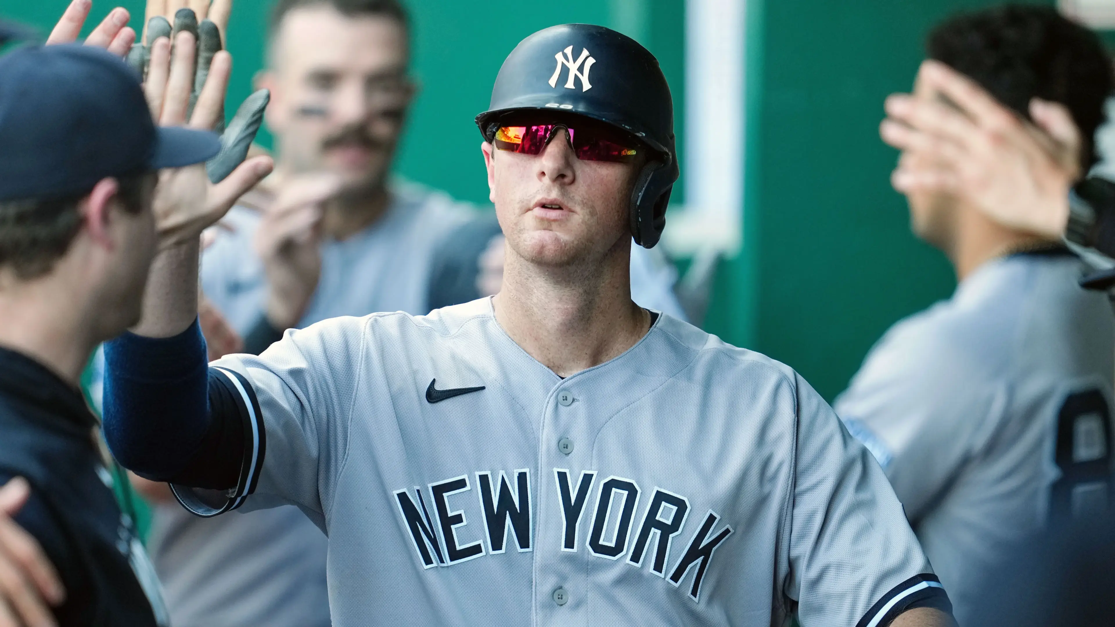 New York Yankees first baseman DJ LeMahieu (26) is congratulated by teammate after scoring during the sixth inning against the Kansas City Royals at Kauffman Stadium / Jay Biggerstaff - USA TODAY Sports