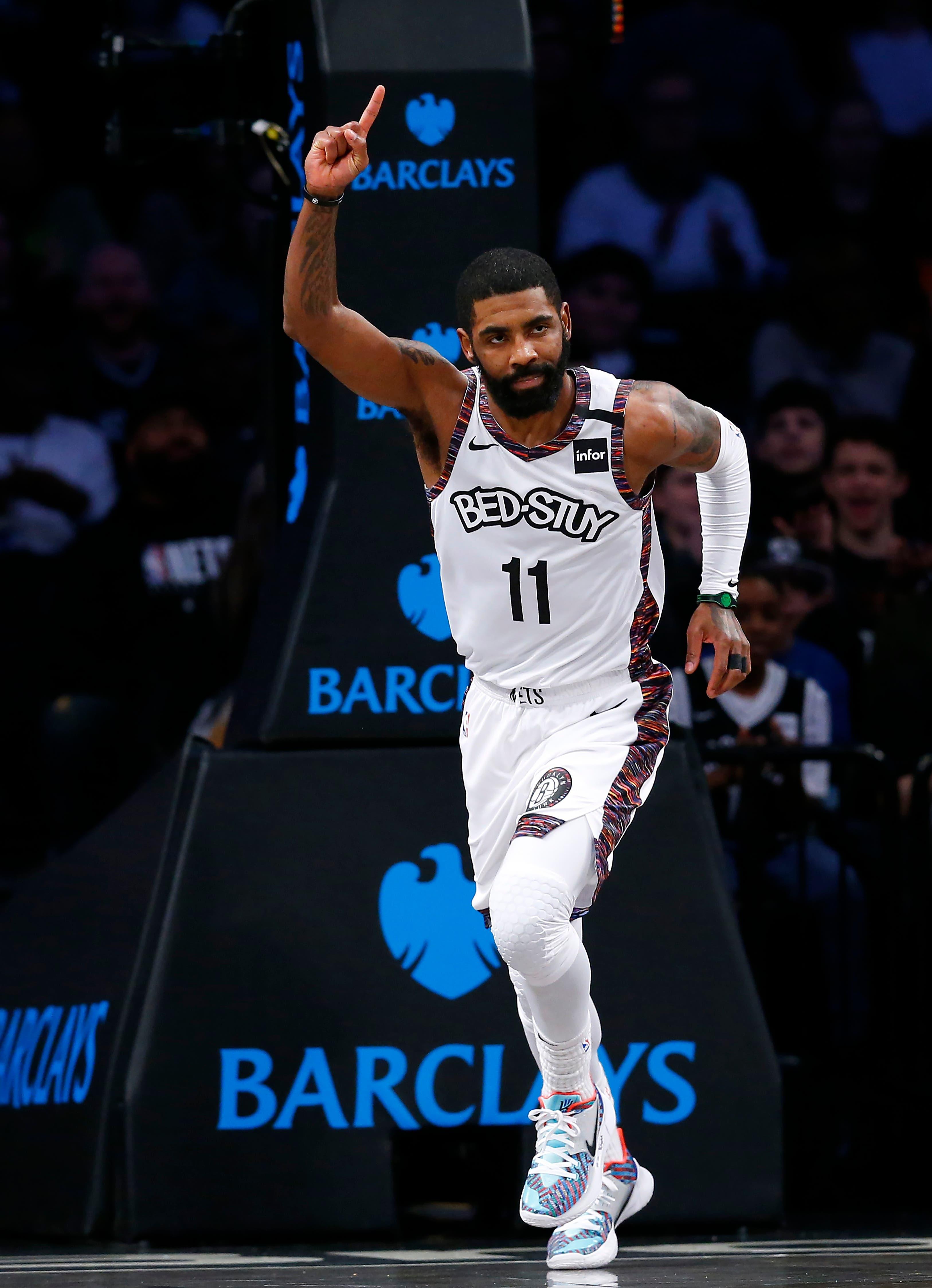 Jan 31, 2020; Brooklyn, New York, USA; Brooklyn Nets guard Kyrie Irving (11) reacsts after scoring against the Chicago Bulls during the first half at Barclays Center. Mandatory Credit: Noah K. Murray-USA TODAY Sports / Noah K. Murray