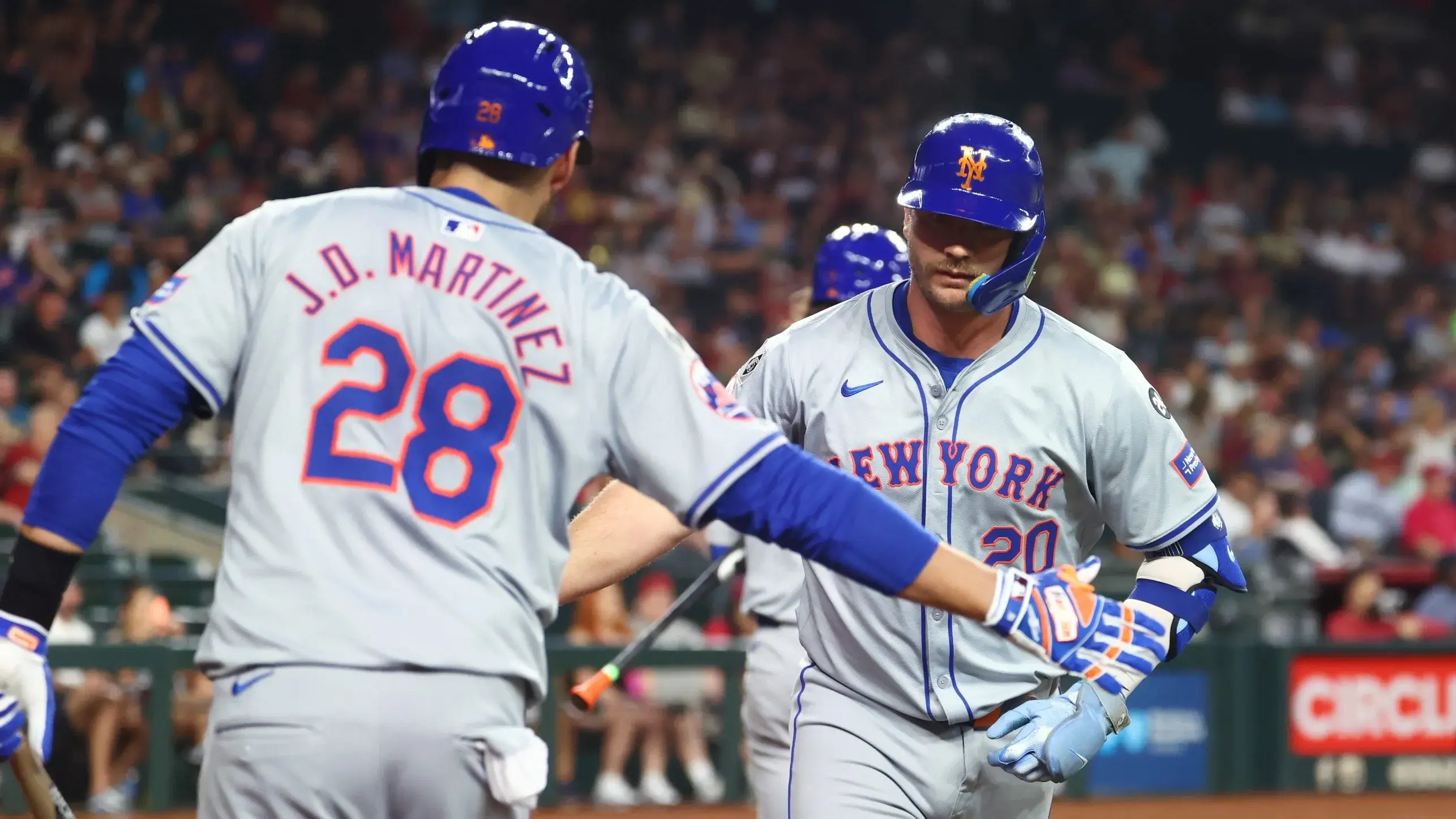 Caption: Aug 27, 2024; Phoenix, Arizona, USA; New York Mets first baseman Pete Alonso (right) celebrates with J.D. Martinez after hitting a solo home run in the second inning against the Arizona Diamondbacks at Chase Field. / Mark J. Rebilas-USA TODAY Sports