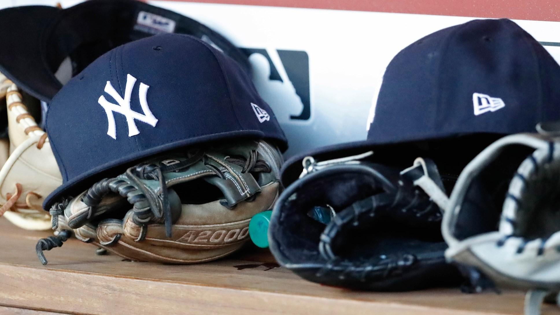 Jun 18, 2018; Washington, DC, USA; New York Yankees players caps and gloves rest in the dugout against the Washington Nationals at Nationals Park. / Geoff Burke-USA TODAY Sports