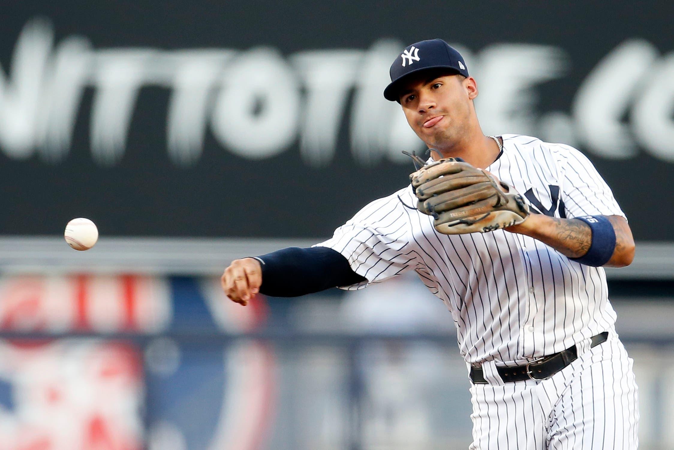 New York Yankees second baseman Gleyber Torres throws to first base against the Kansas City Royals during the first inning at Yankee Stadium. / Adam Hunger/USA TODAY Sports