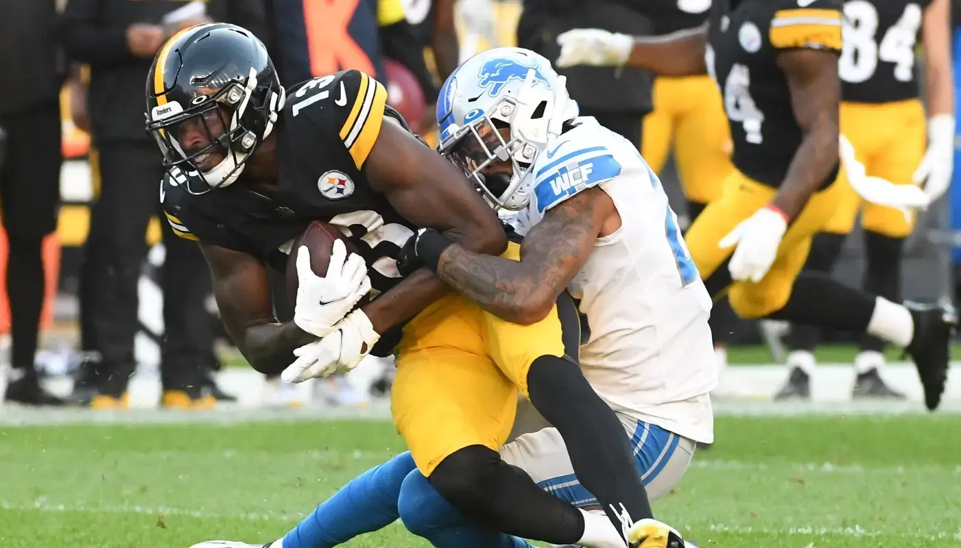 Pittsburgh Steelers wide receiver Miles Boykin (13) is brought down by Detroit Lions cornerback Mark Gilbert (29) during the third quarter at Acrisure Stadium. / Philip G. Pavely-USA TODAY Sports