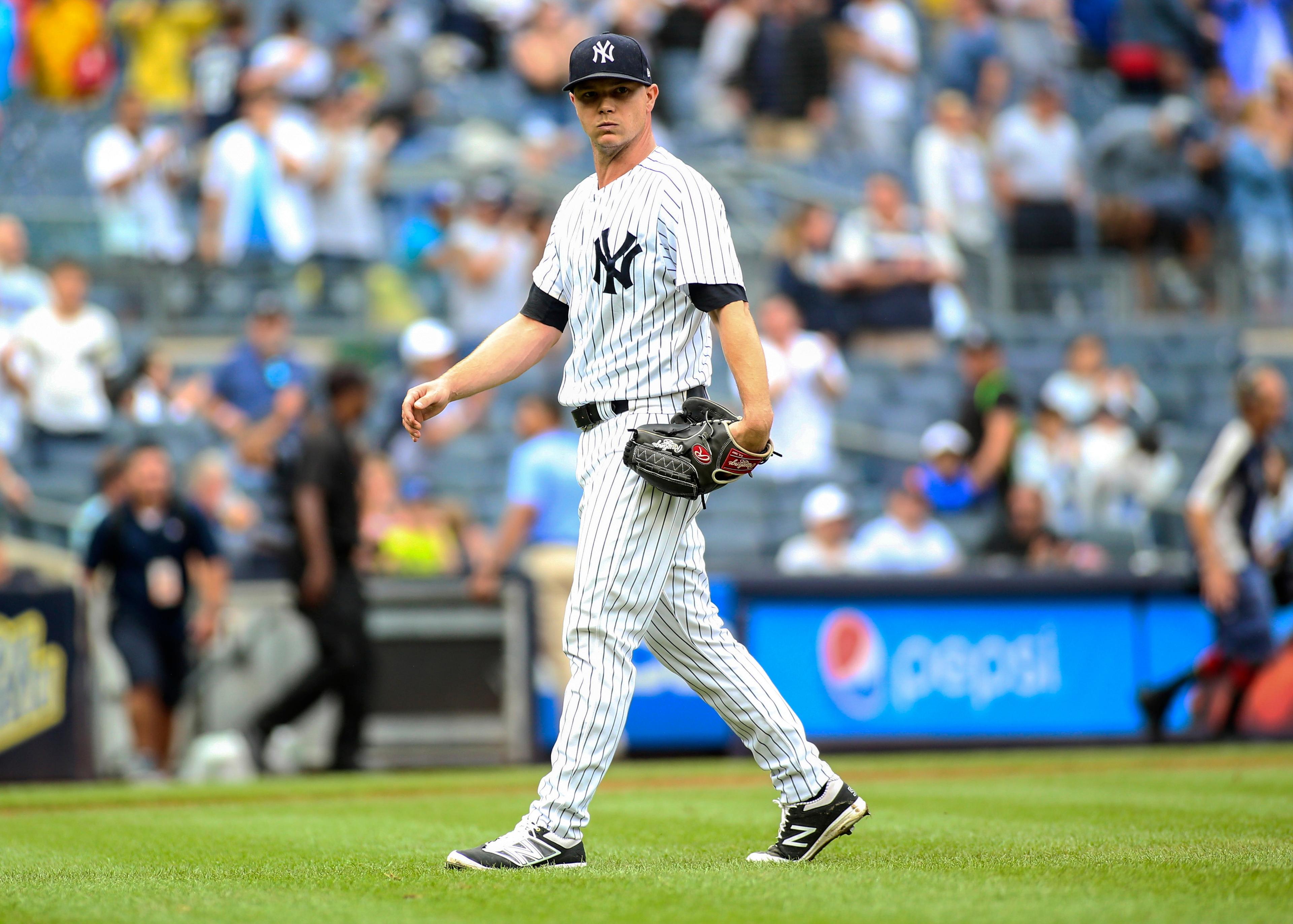 New York Yankees pitcher Sonny Gray walks off the mound after defeating the Toronto Blue Jays 10-2 at Yankee Stadium.