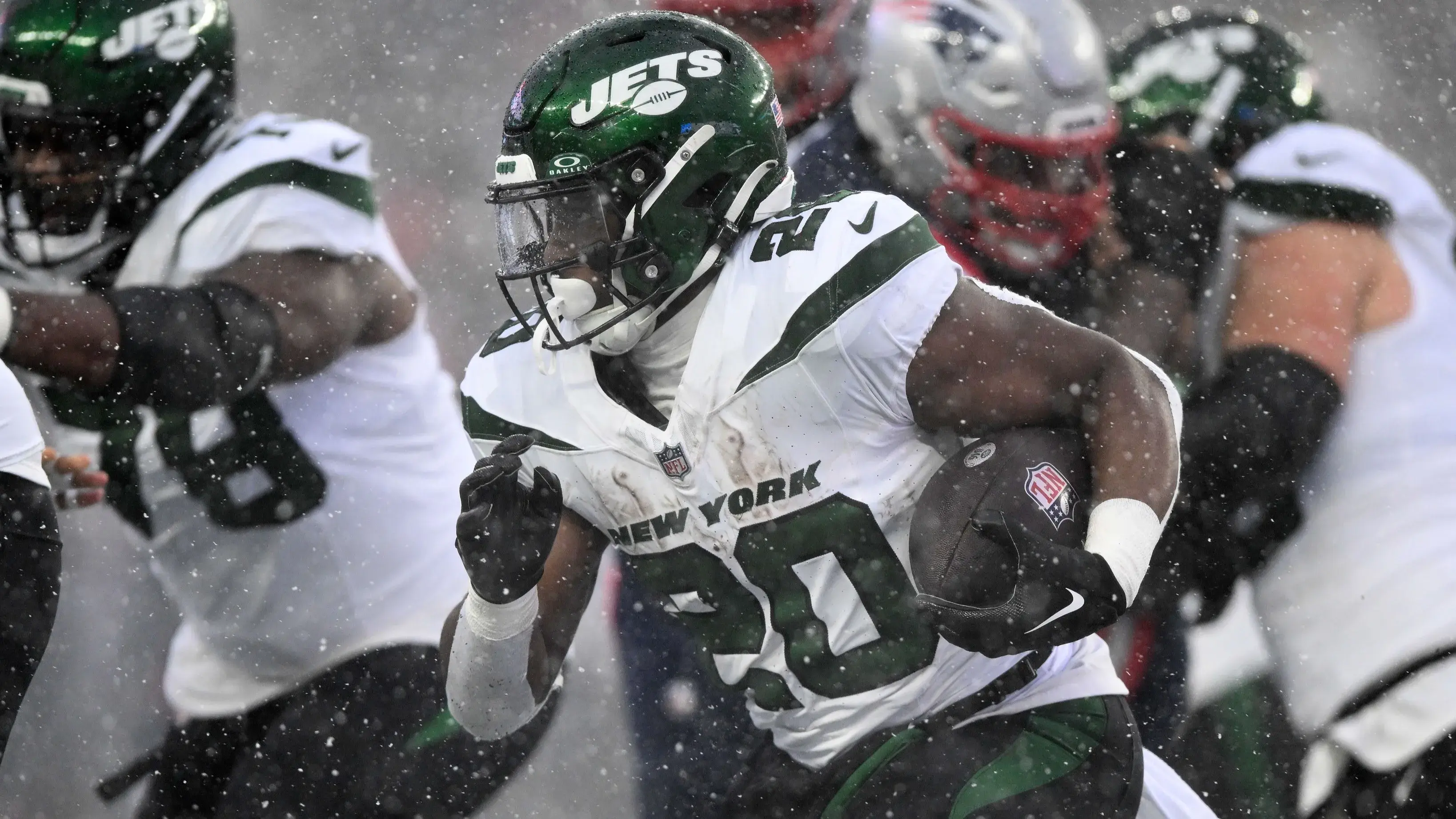 Jan 7, 2024; Foxborough, Massachusetts, USA; New York Jets running back Breece Hall (20) rushes against the New England Patriots during the first half at Gillette Stadium. / Brian Fluharty-USA TODAY Sports