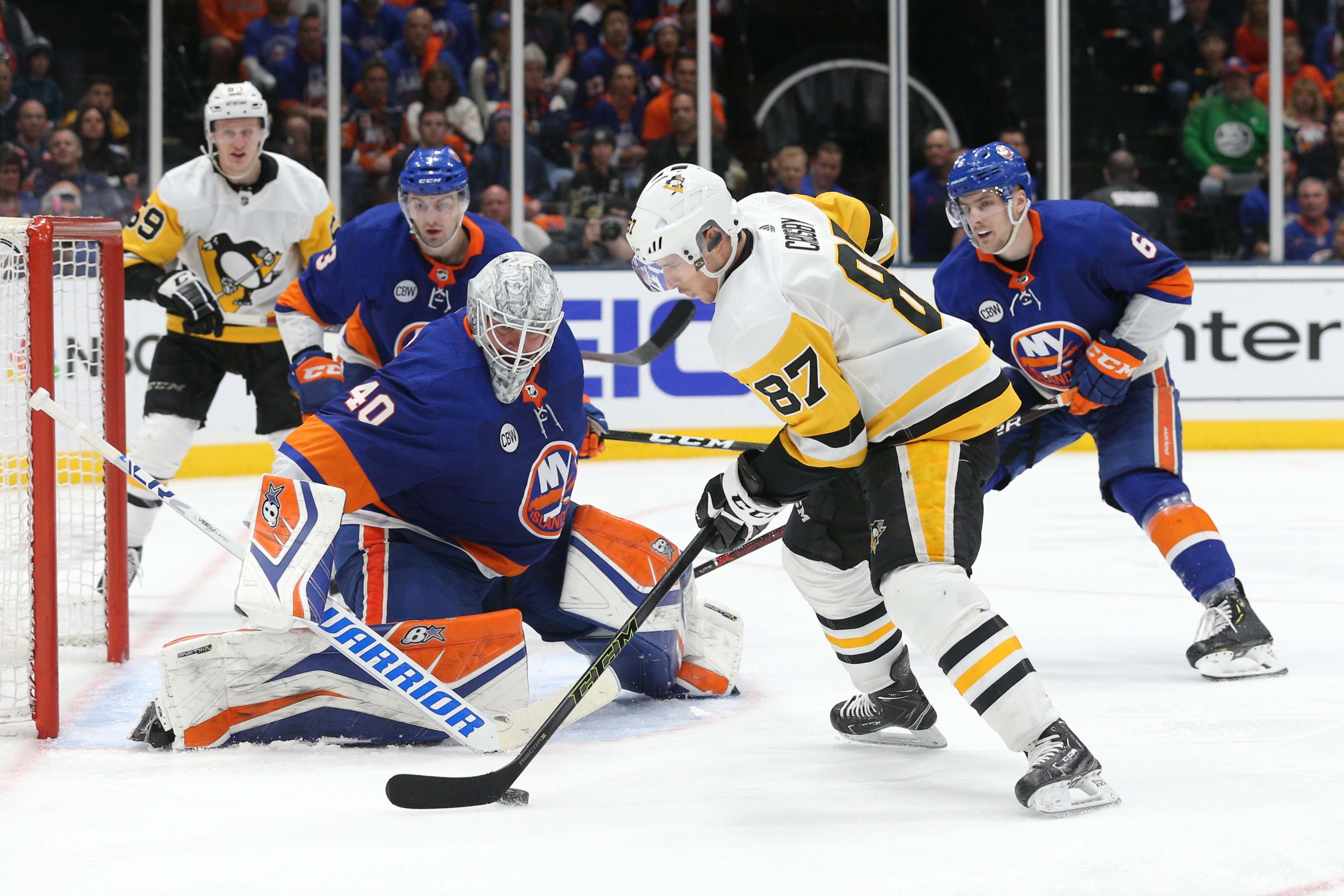 Apr 12, 2019; Uniondale, NY, USA; New York Islanders goalie Robin Lehner (40) makes a save against Pittsburgh Penguins center Sidney Crosby (87) during the third period of game two of the first round of the 2019 Stanley Cup Playoffs at Nassau Veterans Memorial Coliseum. Mandatory Credit: Brad Penner-USA TODAY Sports