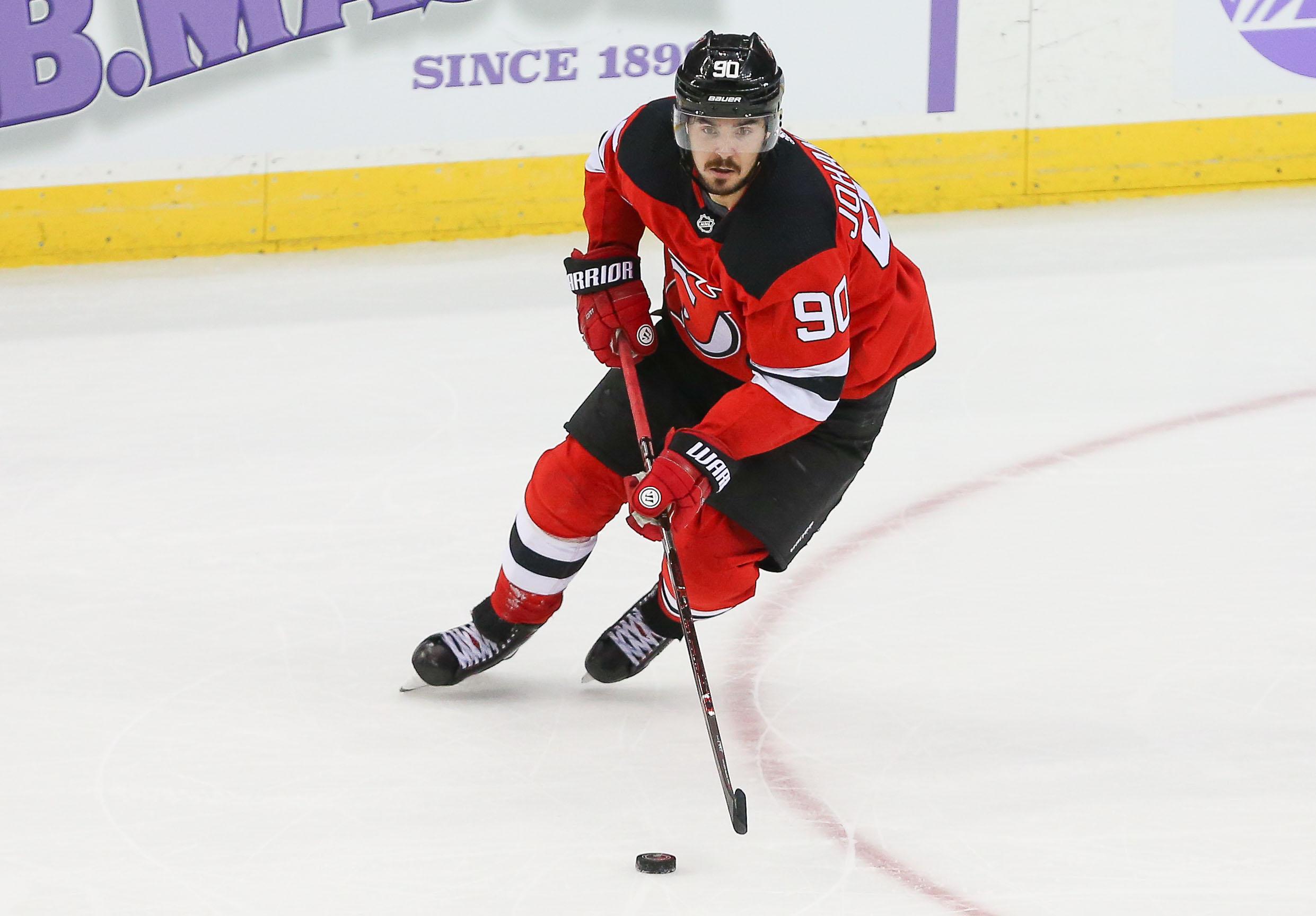 Nov 23, 2018; Newark, NJ, USA; New Jersey Devils left wing Marcus Johansson (90) carries the puck during the overtime against the New York Islanders at Prudential Center. Mandatory Credit: Vincent Carchietta-USA TODAY Sports