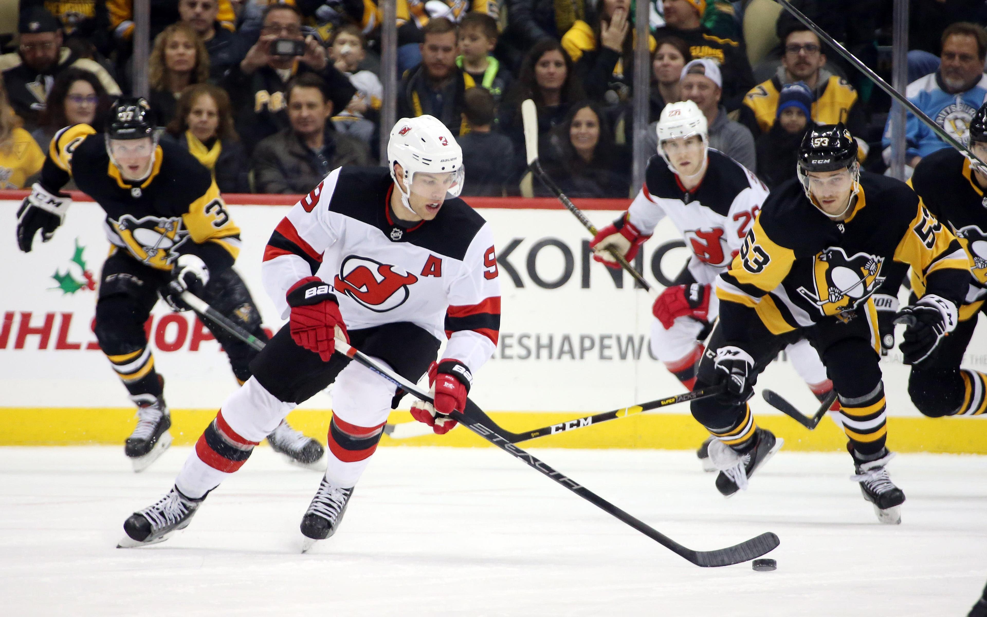 Nov 22, 2019; Pittsburgh, PA, USA; New Jersey Devils left wing Taylor Hall (9) skates with the puck against the Pittsburgh Penguins during the third period at PPG PAINTS Arena. Pittsburgh won 4-1. Mandatory Credit: Charles LeClaire-USA TODAY Sports / Charles LeClaire