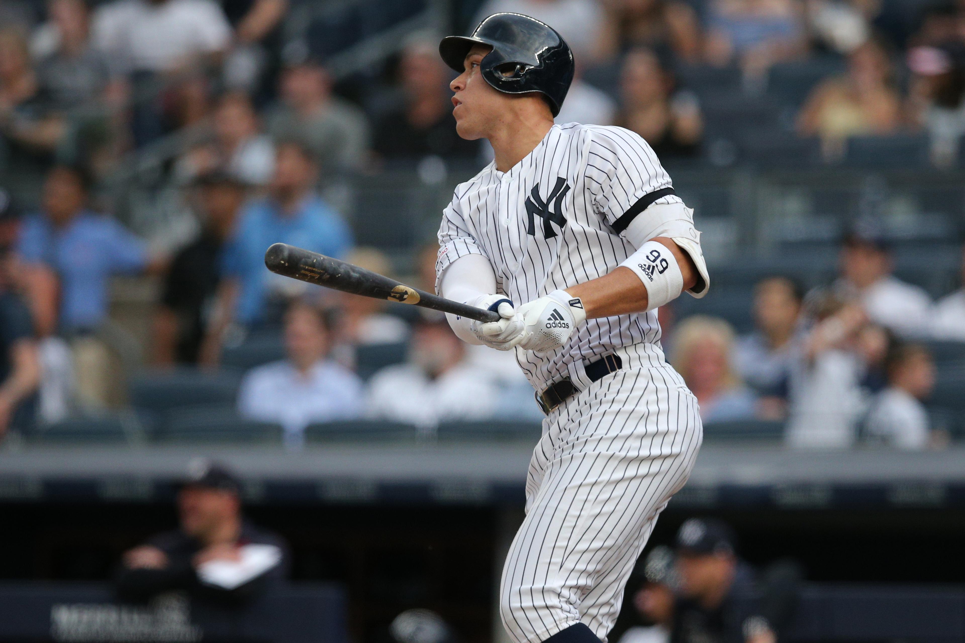 Jun 25, 2019; Bronx, NY, USA; New York Yankees right fielder Aaron Judge (99) follows through on a solo home run against the Toronto Blue Jays during the first inning at Yankee Stadium. Mandatory Credit: Brad Penner-USA TODAY Sports