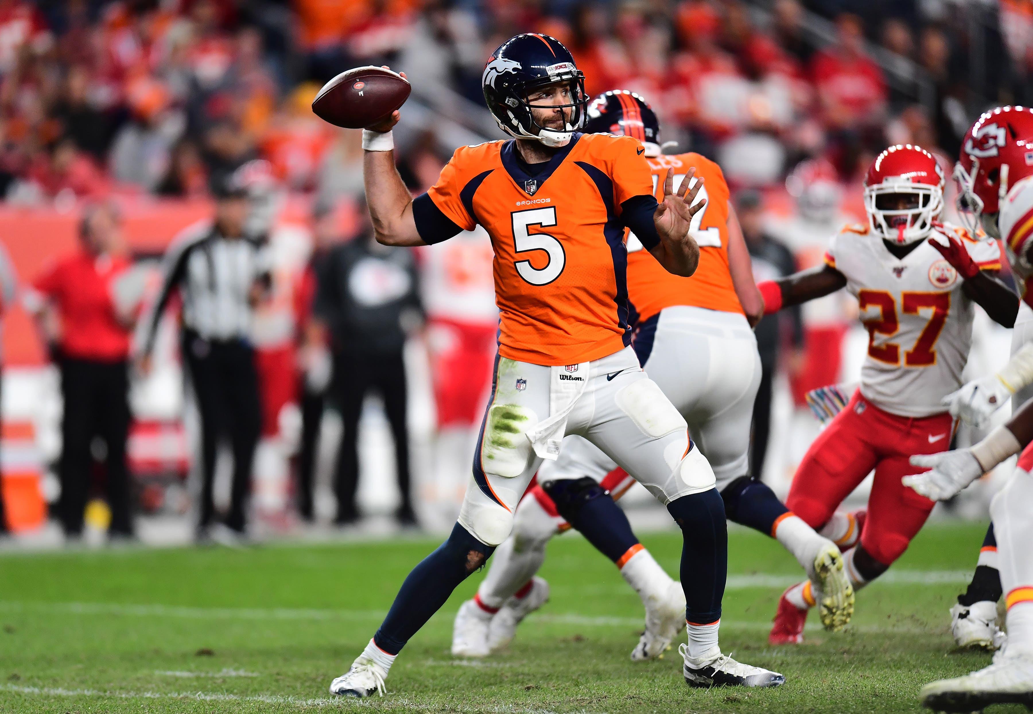 Oct 17, 2019; Denver, CO, USA; Denver Broncos quarterback Joe Flacco (5) prepares to pass in the second quarter against the Kansas City Chiefs at Empower Field at Mile High. Mandatory Credit: Ron Chenoy-USA TODAY Sports / Ron Chenoy