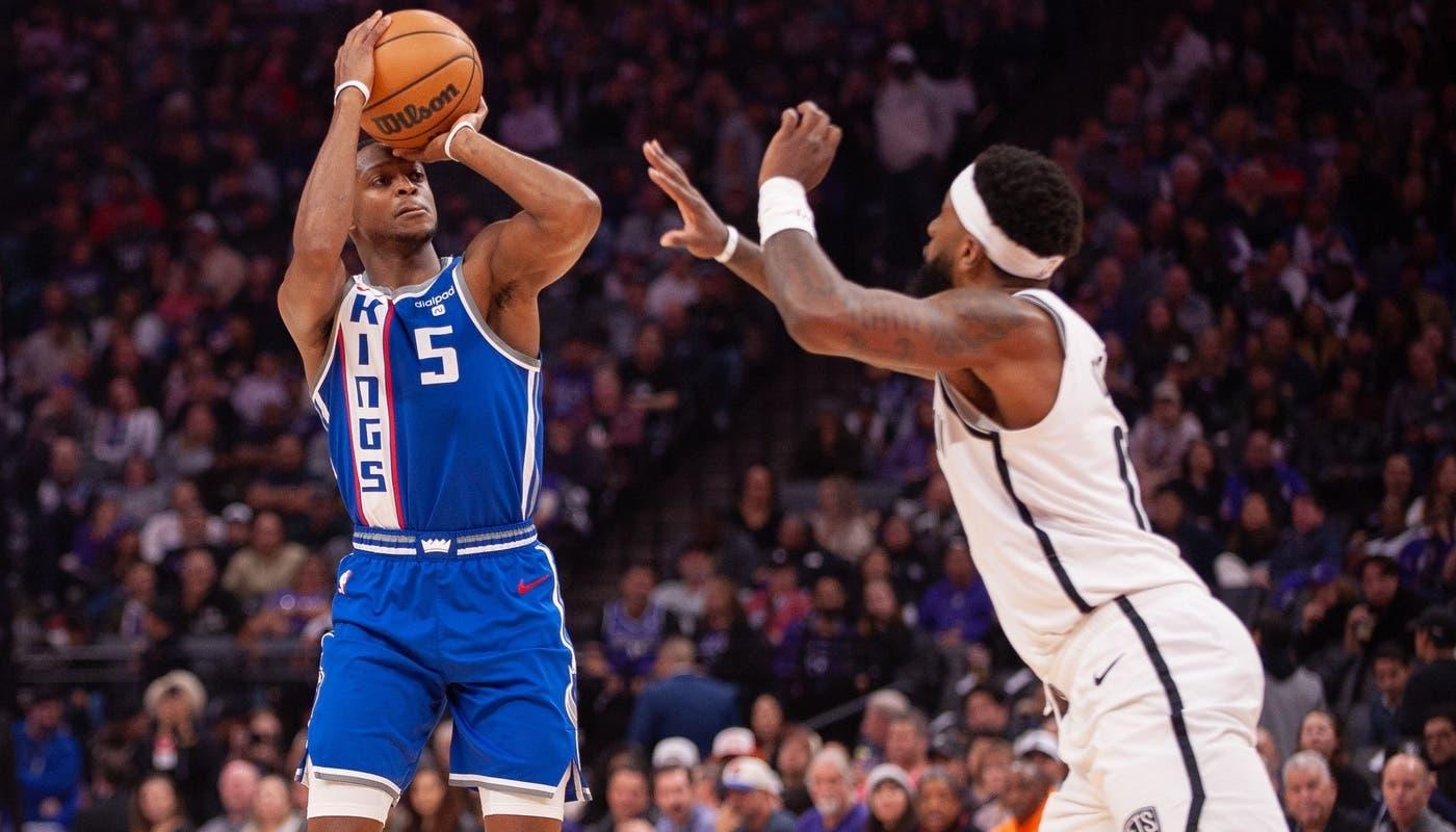 Sacramento Kings guard De'Aaron Fox (5) takes a jump shot during the first quarter at Golden 1 Center. / Ed Szczepanski-USA TODAY Sports