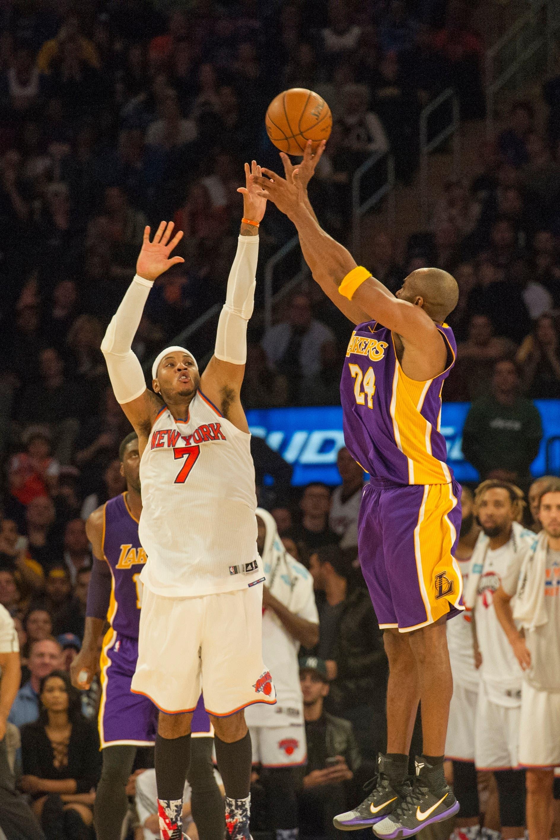 Los Angeles Lakers small forward Kobe Bryant (24) shoots the ball over New York Knicks small forward Carmelo Anthony (7) defending during the 4th qtr at Madison Square Garden. / Gregory Fisher