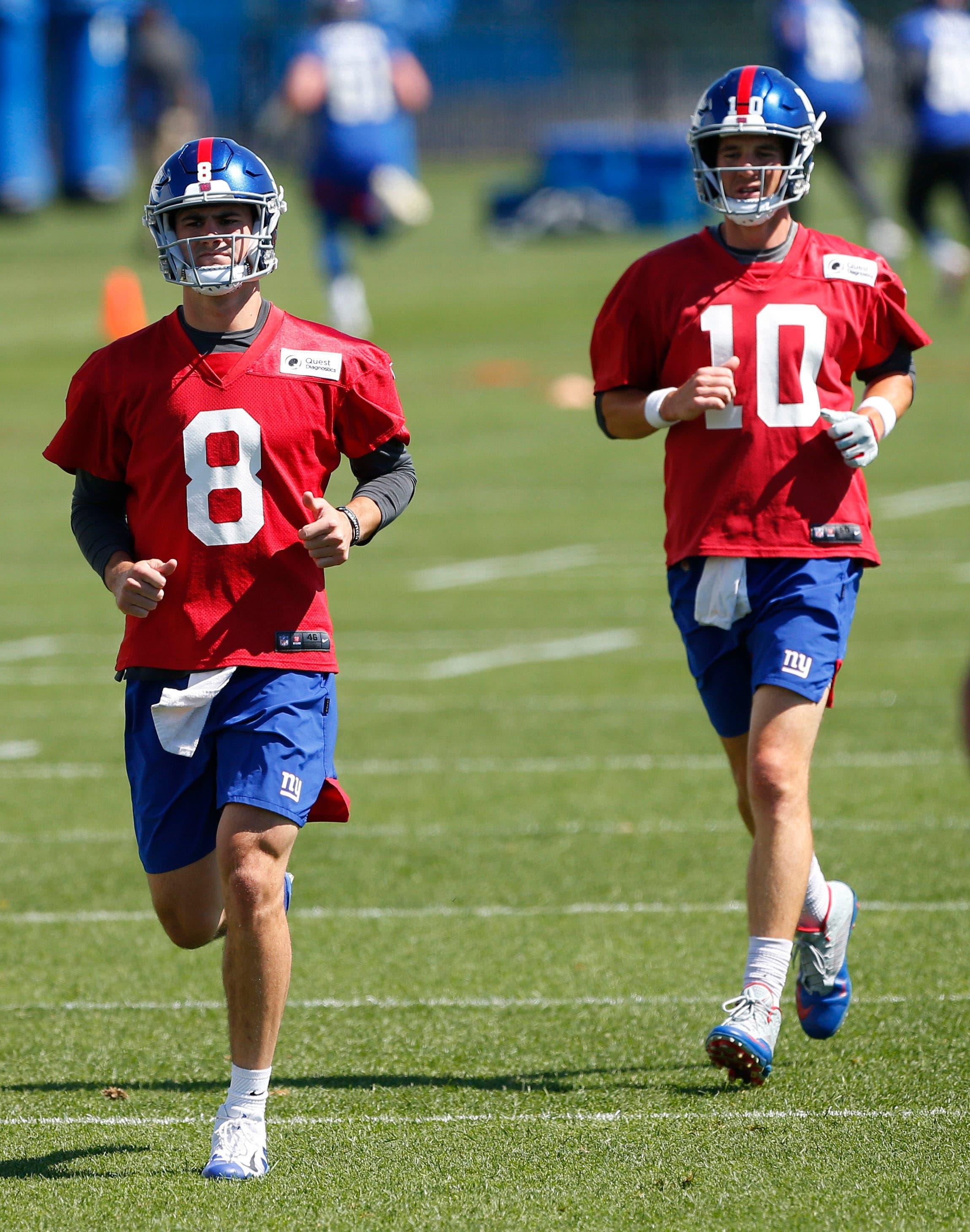 Jun 4, 2019; East Rutherford, NJ, USA; New York Giants rookie quarterback Daniel Jones (8) and New York Giants quarterback Eli Manning (10) warm up during mini camp at Quest Diagnostic Training Center. Mandatory Credit: Noah K. Murray-USA TODAY Sports / Noah K. Murray