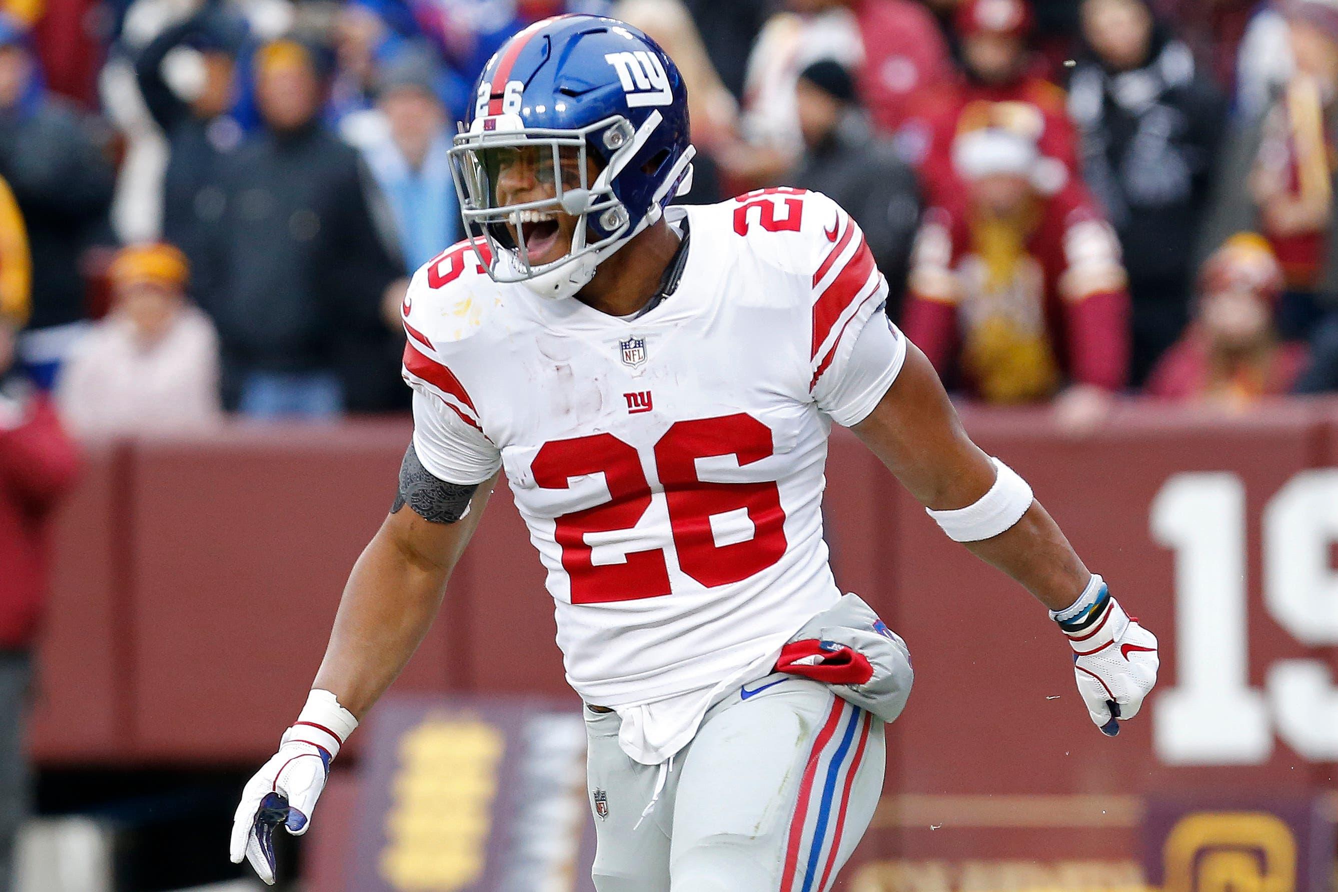 New York Giants running back Saquon Barkley celebrates after scoring a touchdown against the Washington Redskins in the second quarter at FedEx Field. / Geoff Burke/USA TODAY Sports