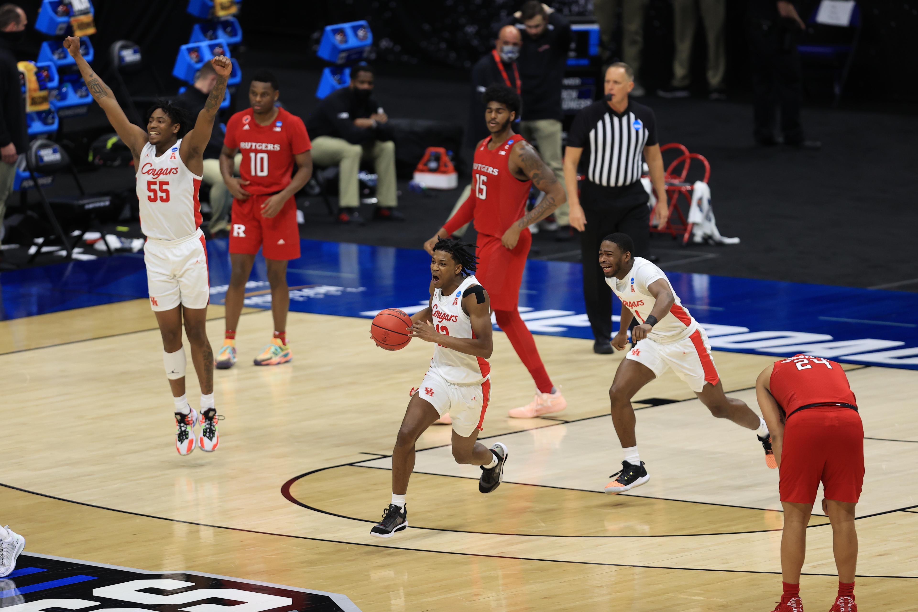 Mar 21, 2021; Indianapolis, Indiana, USA; Houston Cougars guard Tramon Mark (12) celebrates with his team after defeating the Rutgers Scarlet Knights in the second round of the 2021 NCAA Tournament at Lucas Oil Stadium. Mandatory Credit: Aaron Doster-USA TODAY Sports / © Aaron Doster-USA TODAY Sports