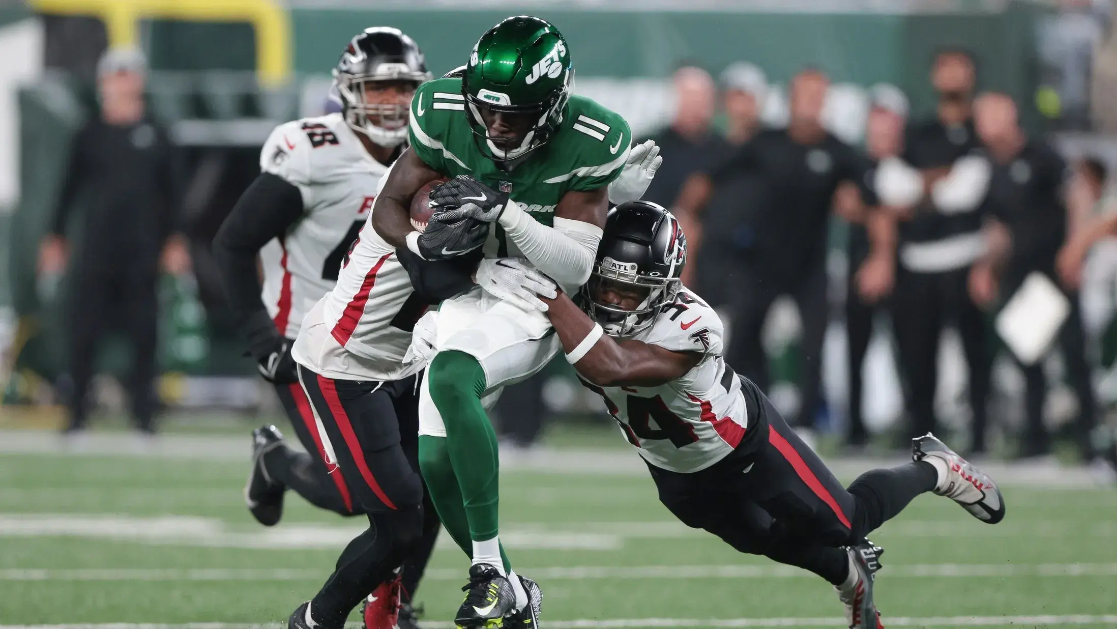 Aug 22, 2022; East Rutherford, New Jersey, USA; New York Jets wide receiver Denzel Mims (11) gains yards after the catch as Atlanta Falcons cornerback Darren Hall (34) tackles during the first half at MetLife Stadium. / Vincent Carchietta-USA TODAY Sports