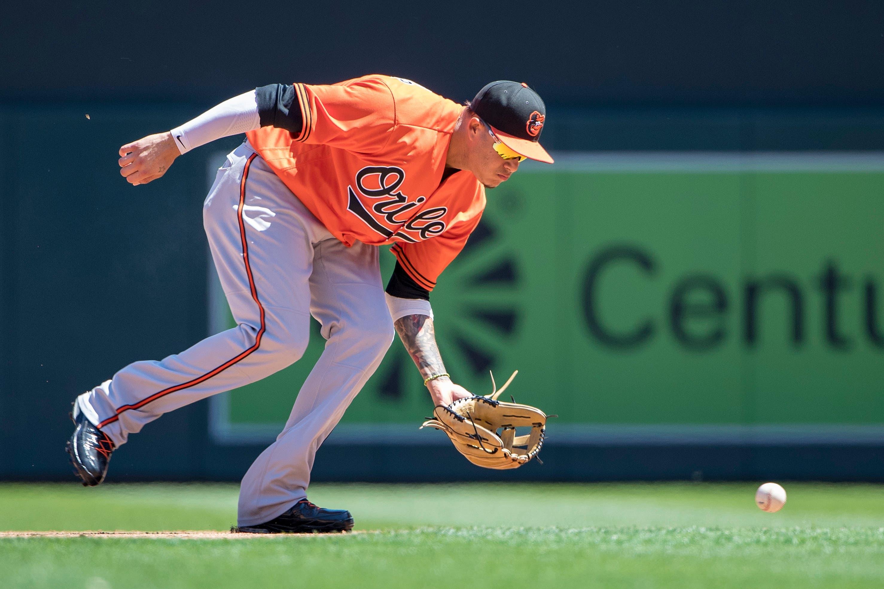 Jul 7, 2018; Minneapolis, MN, USA; Baltimore Orioles shortstop Manny Machado (13) fields a ground ball in the fifth inning against the Minnesota Twins at Target Field. Mandatory Credit: Jesse Johnson-USA TODAY Sports / Jesse Johnson