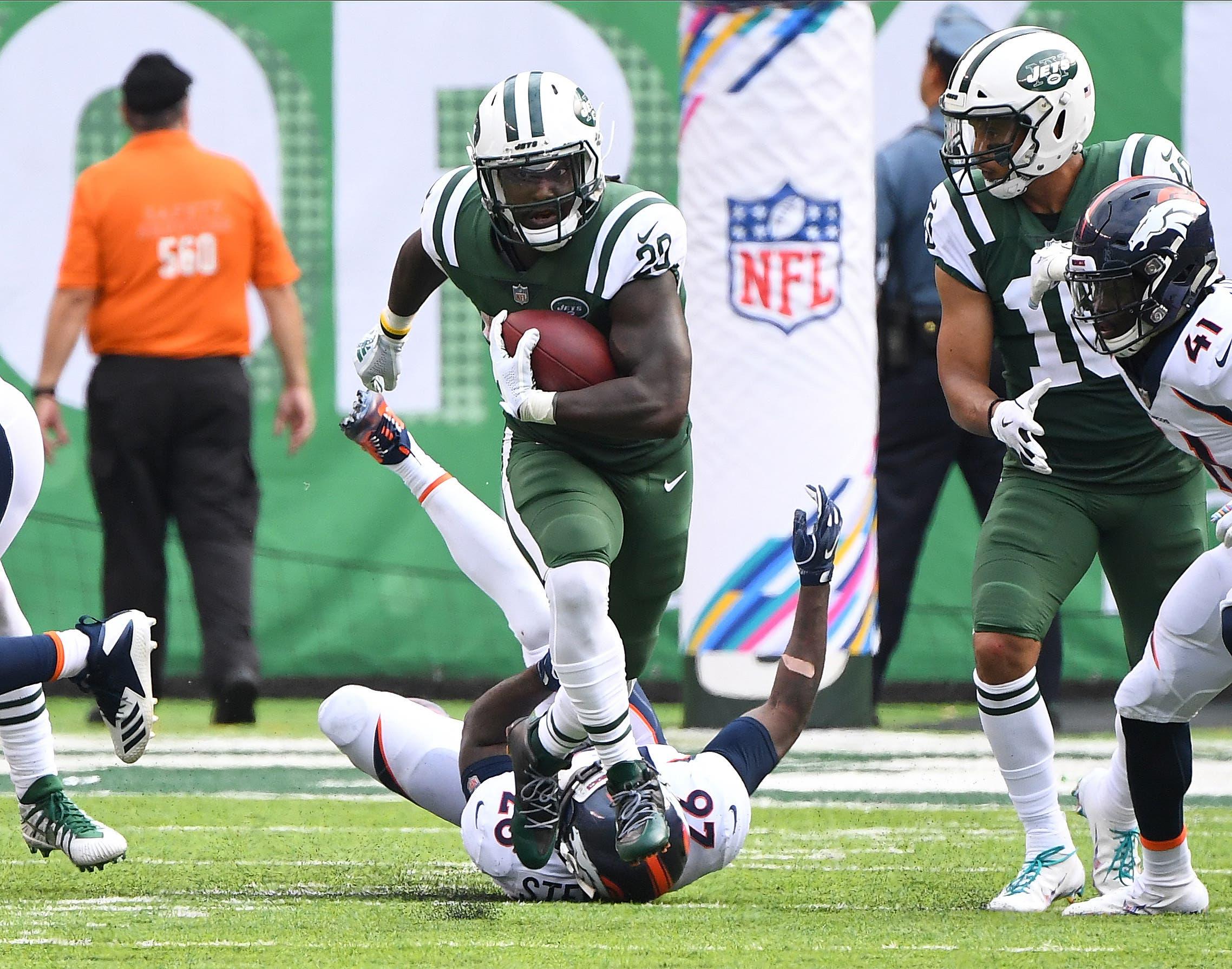 Oct 7, 2018; East Rutherford, NJ, USA; New York Jets running back Isaiah Crowell (20) carries the ball in the second half against the Denver Broncos at MetLife Stadium. Mandatory Credit: Robert Deutsch-USA TODAY Sports / Robert Deutsch