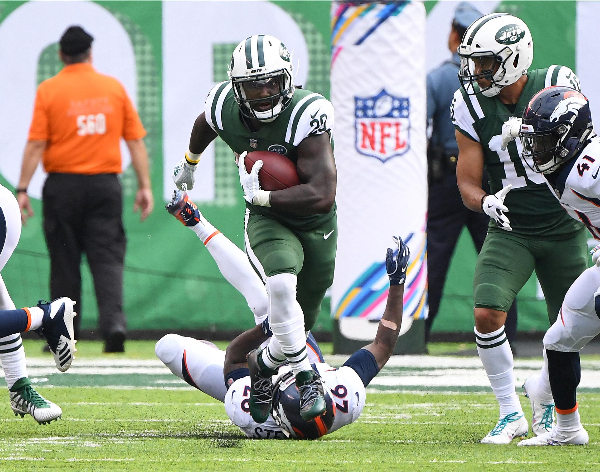 Oct 7, 2018; East Rutherford, NJ, USA; New York Jets running back Isaiah Crowell (20) carries the ball in the second half against the Denver Broncos at MetLife Stadium. Mandatory Credit: Robert Deutsch-USA TODAY Sports