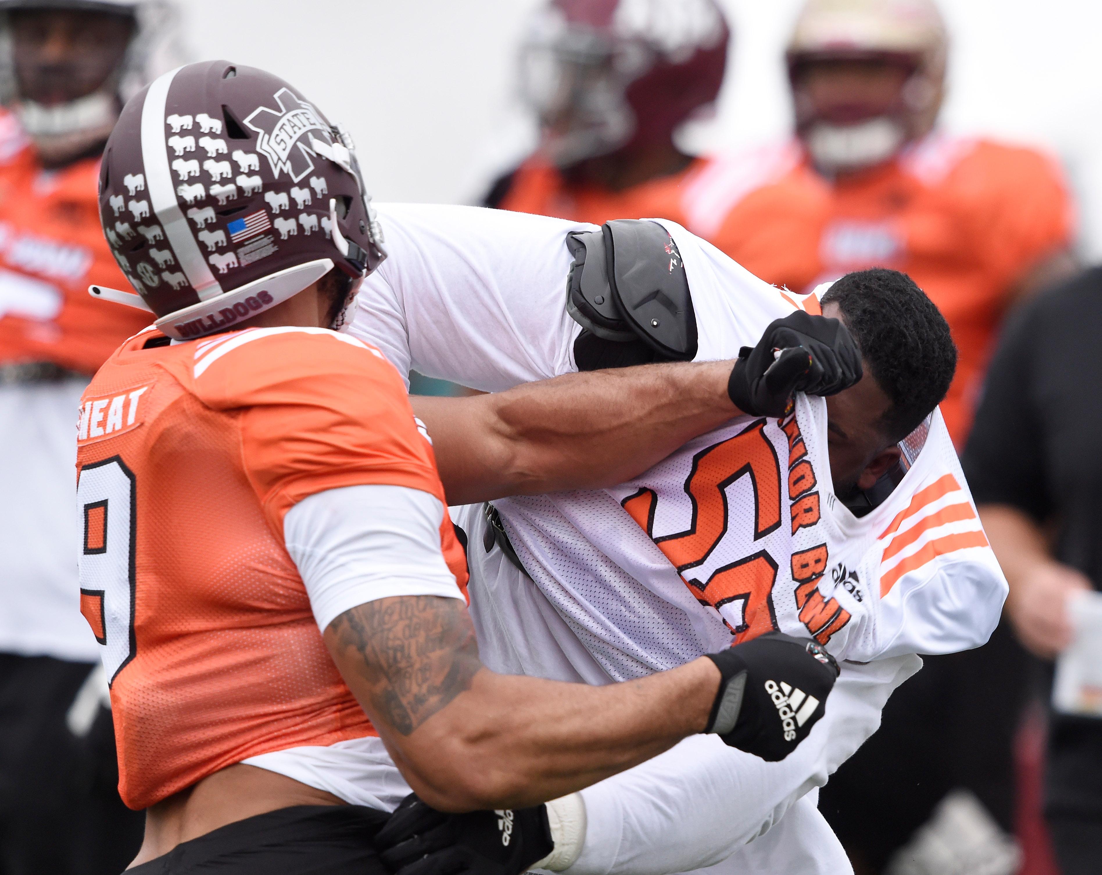 Jan 22, 2019; Mobile, AL, USA; South defensive end Montez Sweat of Mississippi State (9) battles with South offensive tackle Tytus Howard of Alabama State (58) knocking off his helmet during the South squad 2019 Senior Bowl practice at Ladd-Peebles Stadium. Mandatory Credit: John David Mercer-USA TODAY Sports