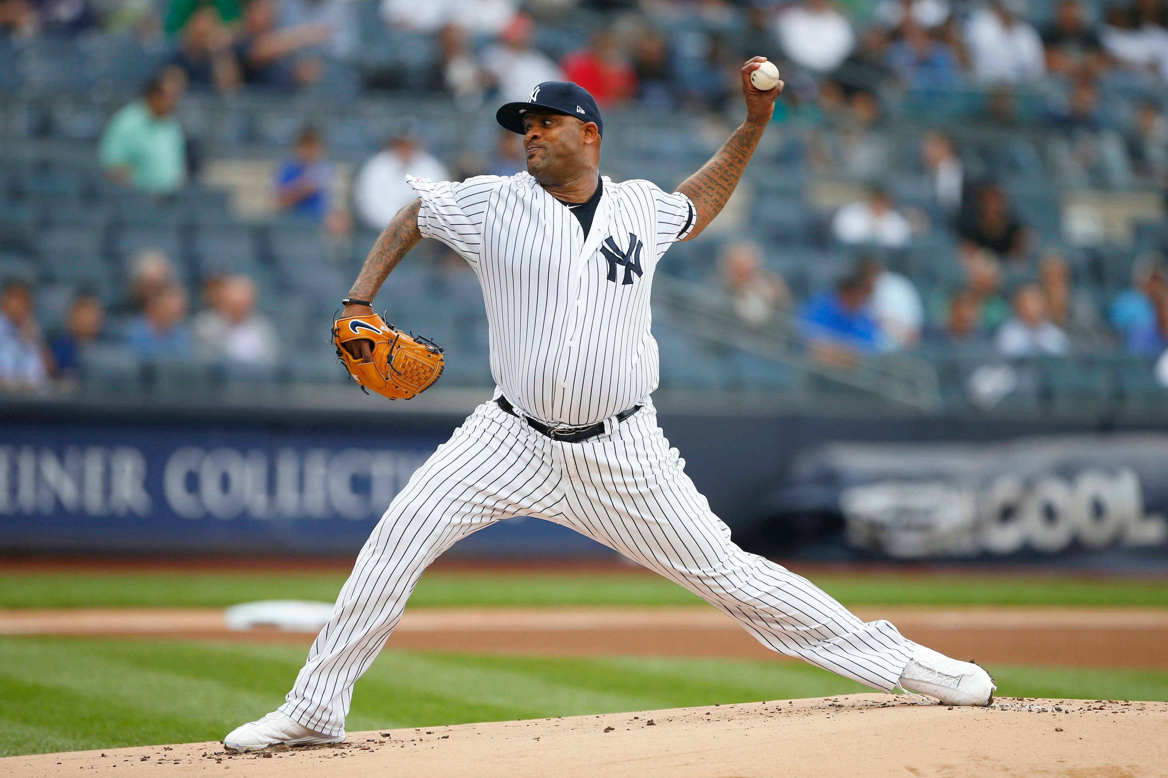 New York Yankees starting pitcher CC Sabathia pitches against the Tampa Bay Rays in the first inning at Yankee Stadium. / Noah K. Murray/USA TODAY Sports