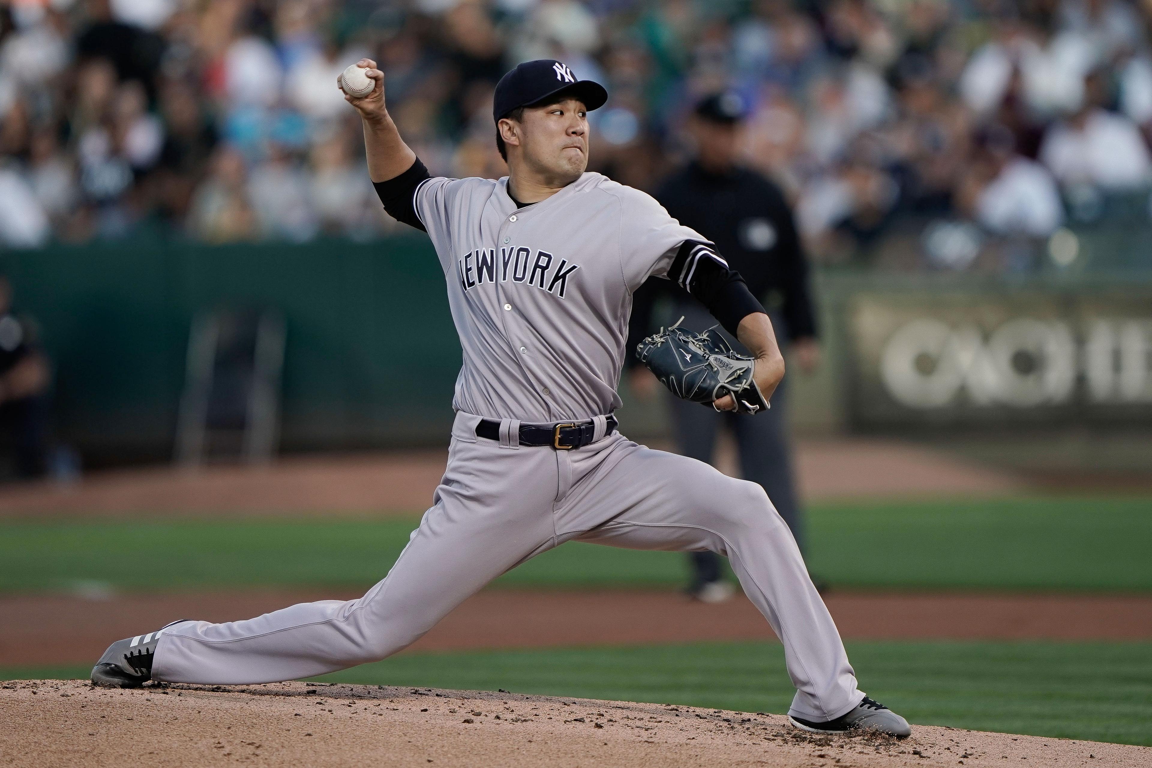 Aug 22, 2019; Oakland, CA, USA; New York Yankees starting pitcher Masahiro Tanaka (19) pitches against the Oakland Athletics during the first inning at the Oakland Coliseum. Mandatory Credit: Stan Szeto-USA TODAY Sports