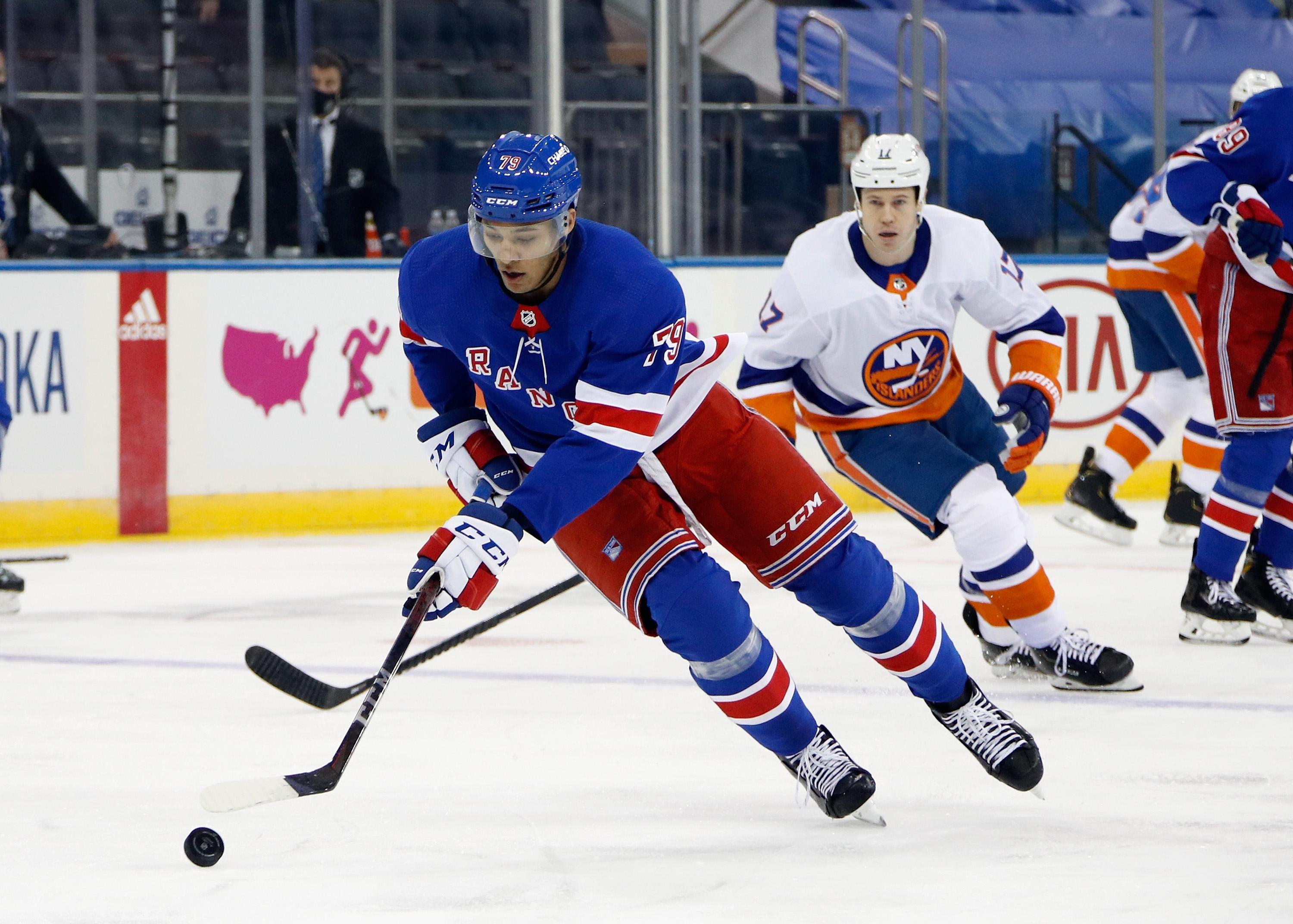 Jan 14, 2021; New York, NY, USA; New York Rangers defenseman K'Andre Miller (79) skates with the puck against the New York Islanders at Madison Square Garden. / © Pool Photo-USA TODAY Sports