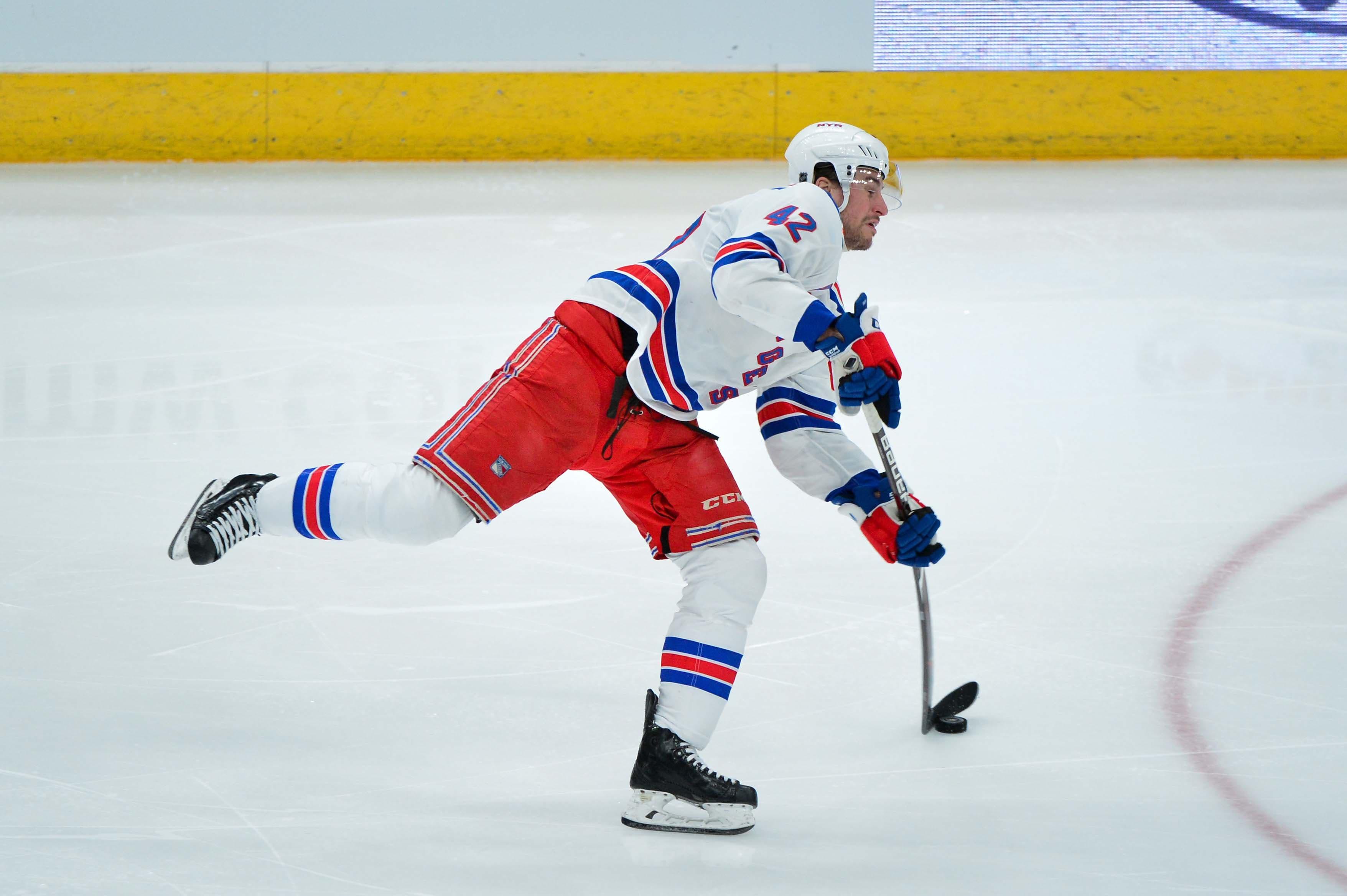 Jan 6, 2019; Glendale, AZ, USA; New York Rangers defenseman Brendan Smith (42) shoots the puck during the second period against the Arizona Coyotes at Gila River Arena. Mandatory Credit: Matt Kartozian-USA TODAY Sports / Matt Kartozian