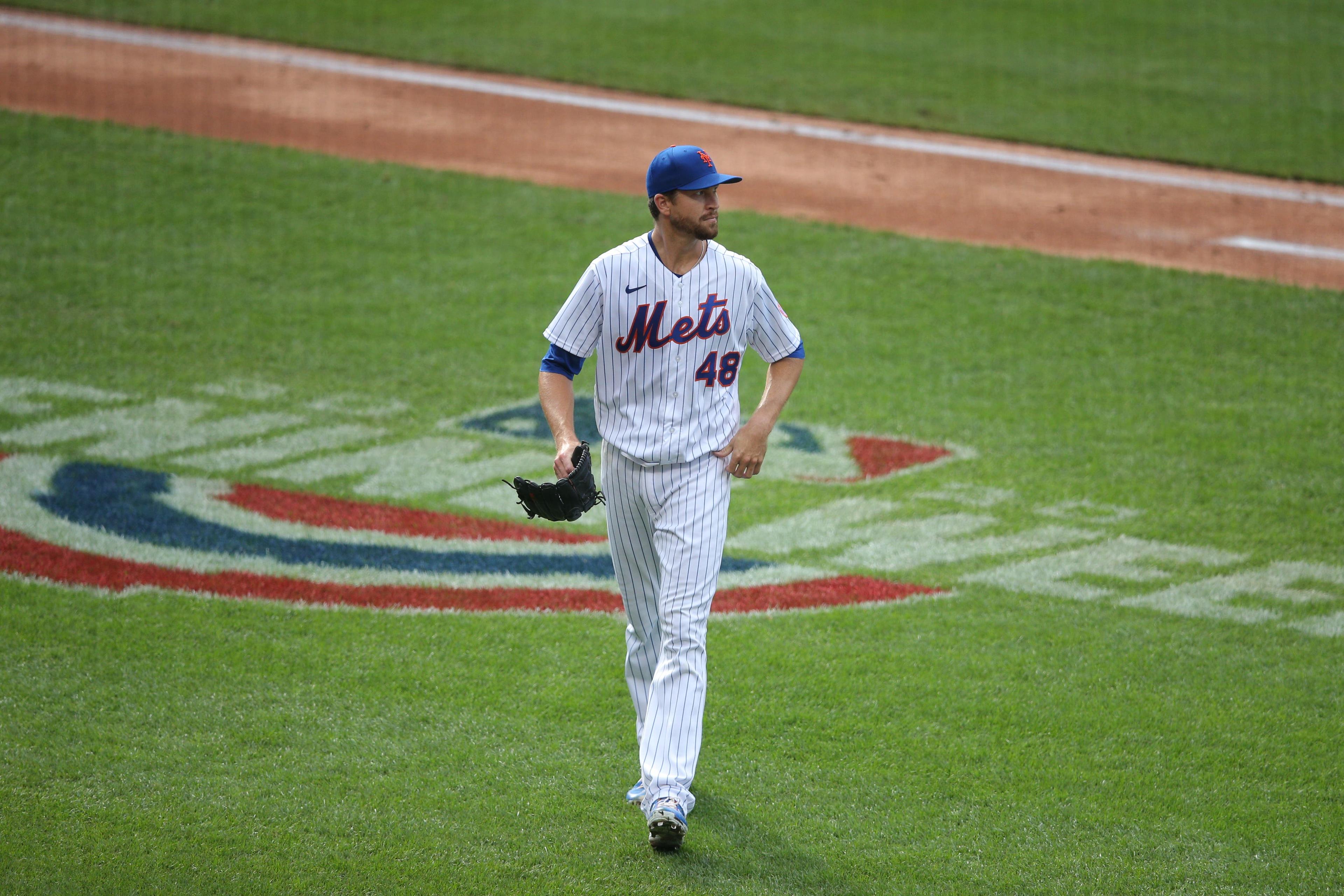 Jacob deGrom walks off the mound during Opening Day / USA Today Sports